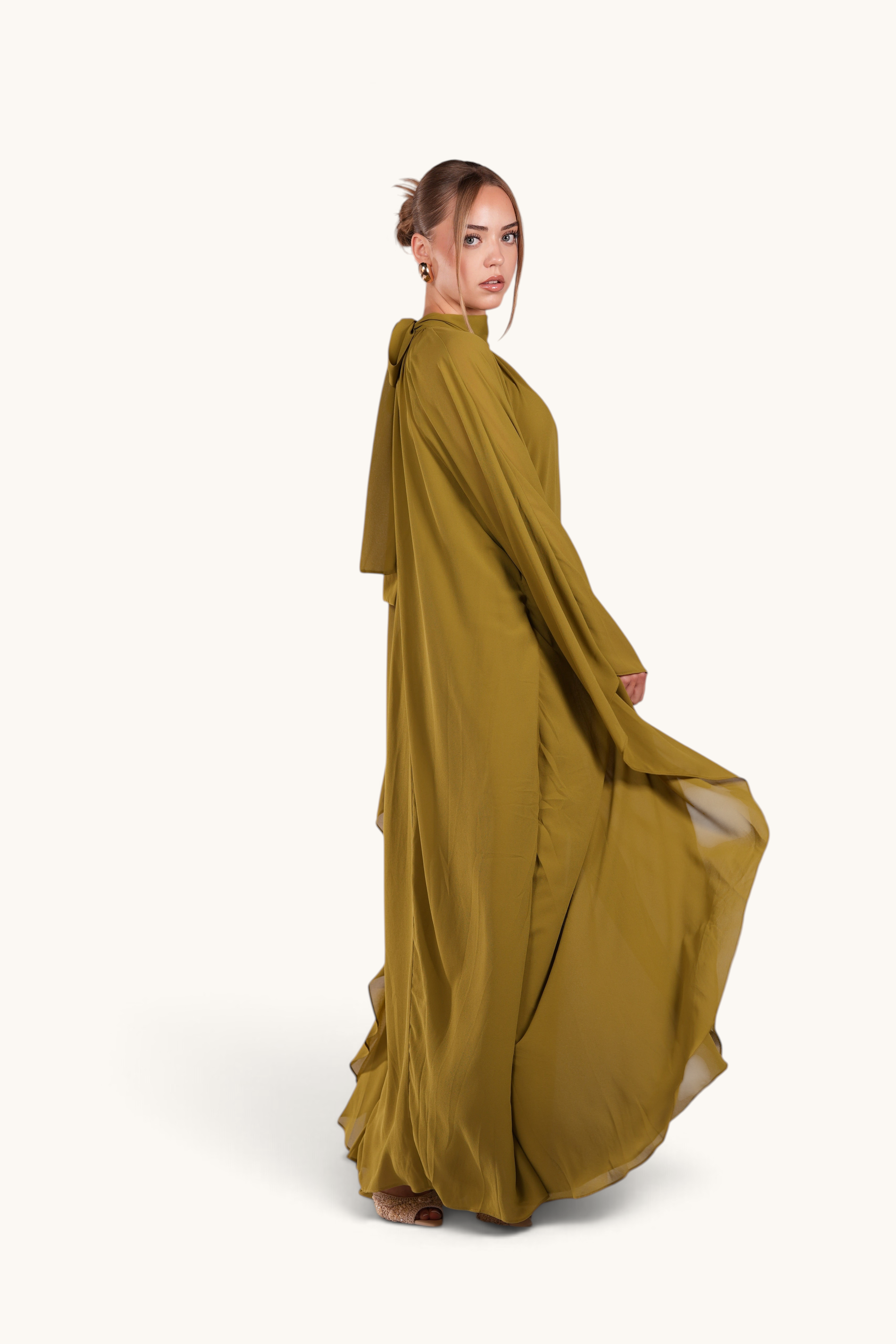 LOSYANA Andalusia lime green chiffon cape dress with elegant flowing silhouette worn by a model