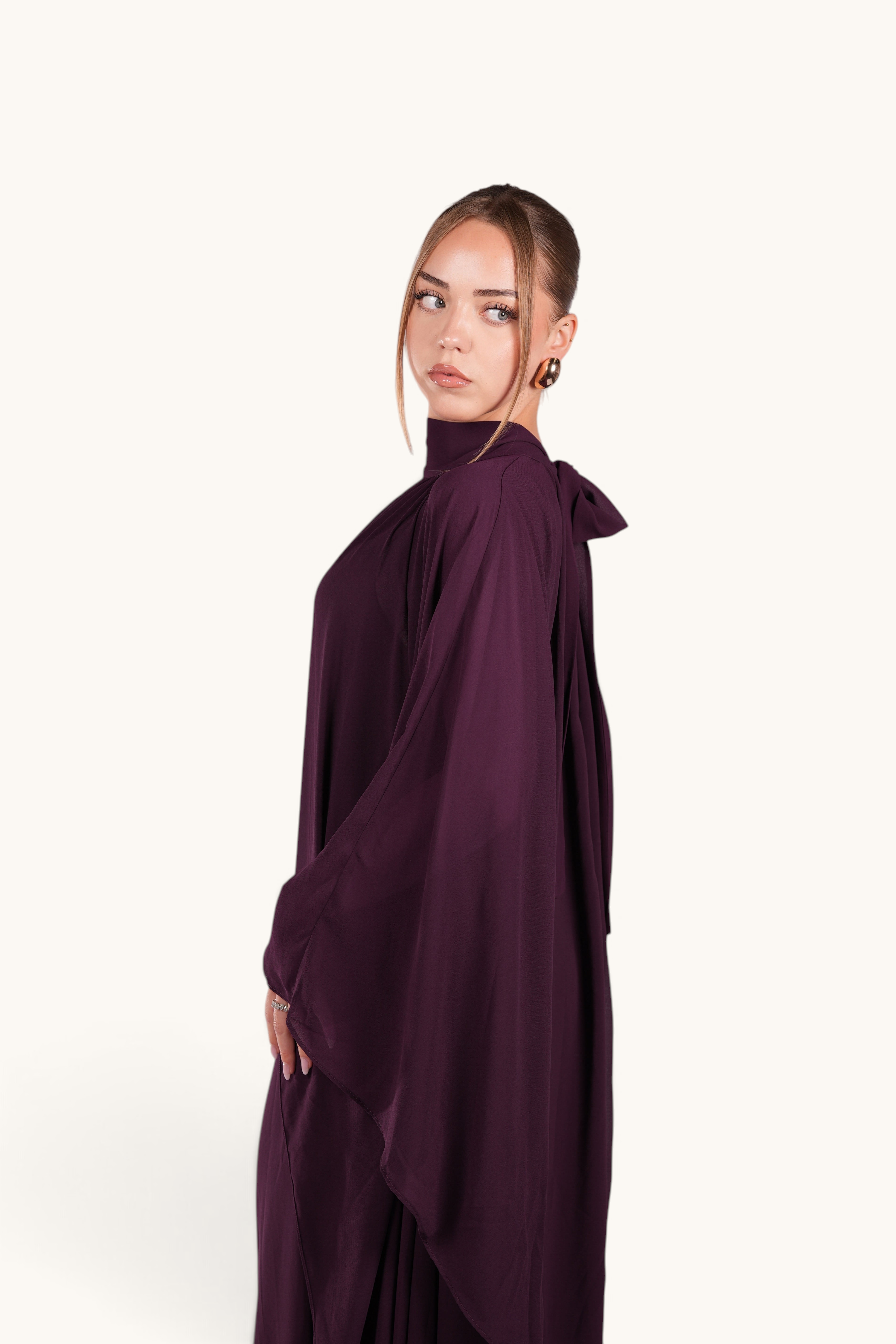 LOSYANA Andalusia mulberry chiffon cape dress with high neck and elegant flowing silhouette worn by a model