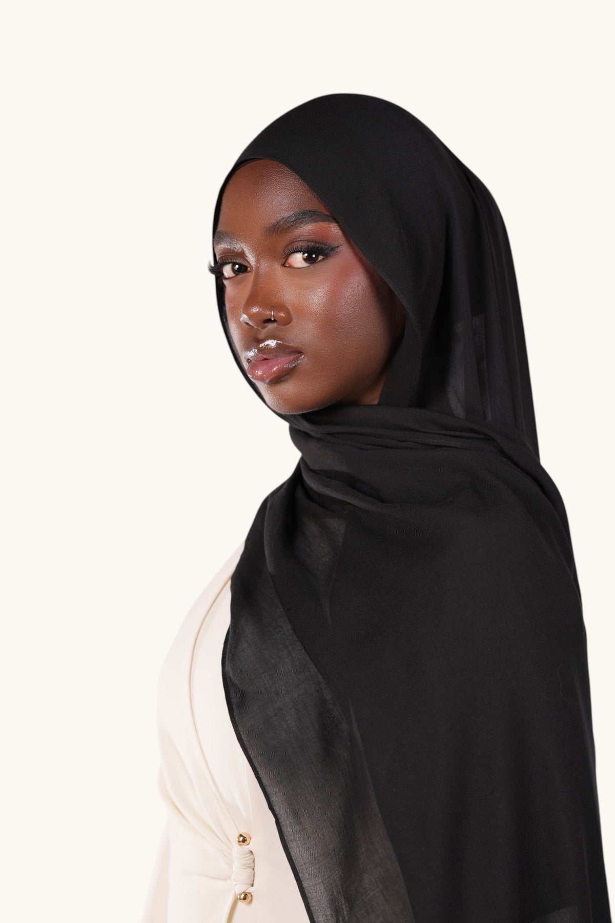 LOSYANA black lightweight modal hijab worn by a model, featuring a soft, elegant drape and slight transparency.
