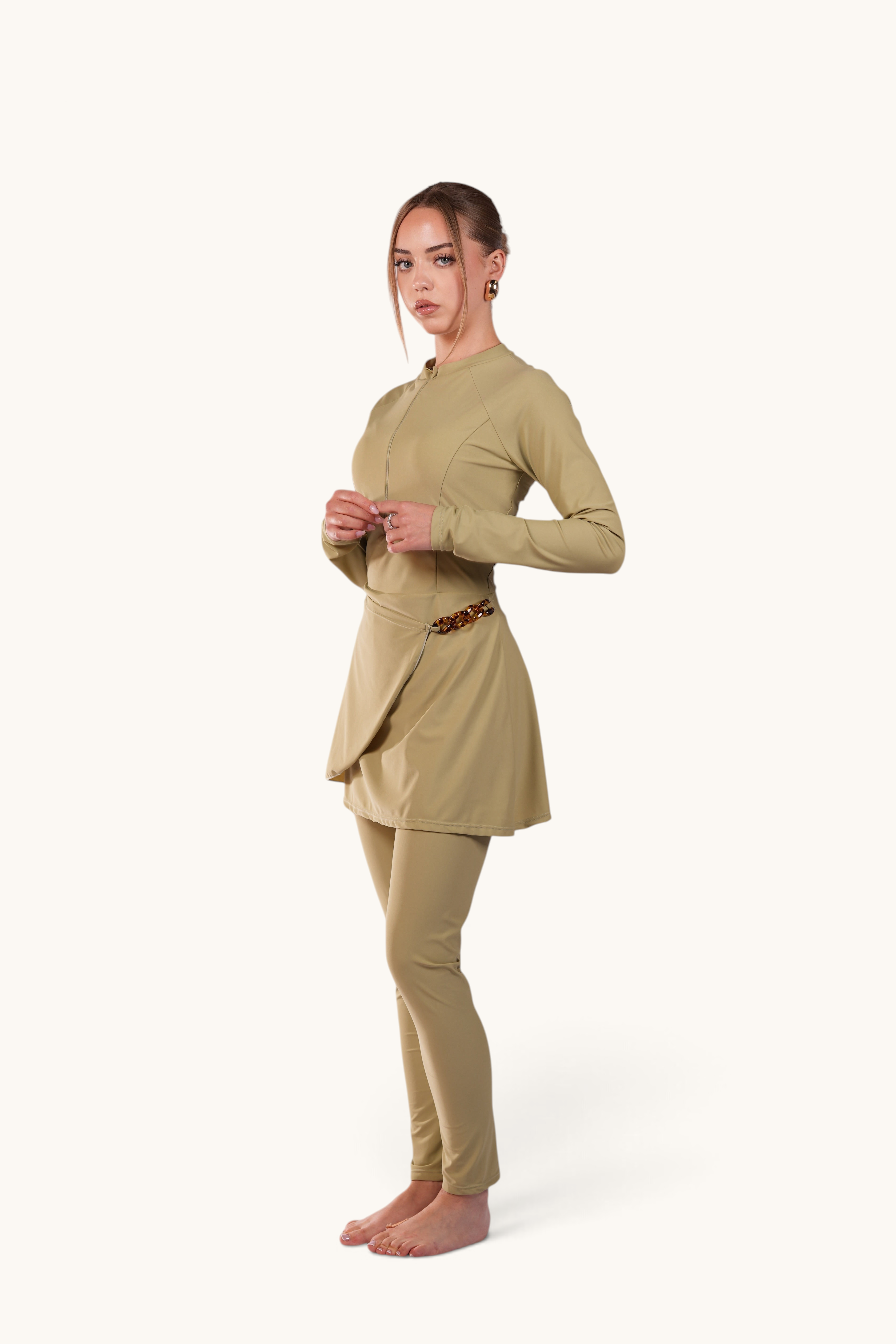 LOSYANA Costa del Sol pistachio green burkini with long-sleeve top, leggings, and elegant acrylic hip chain detail.