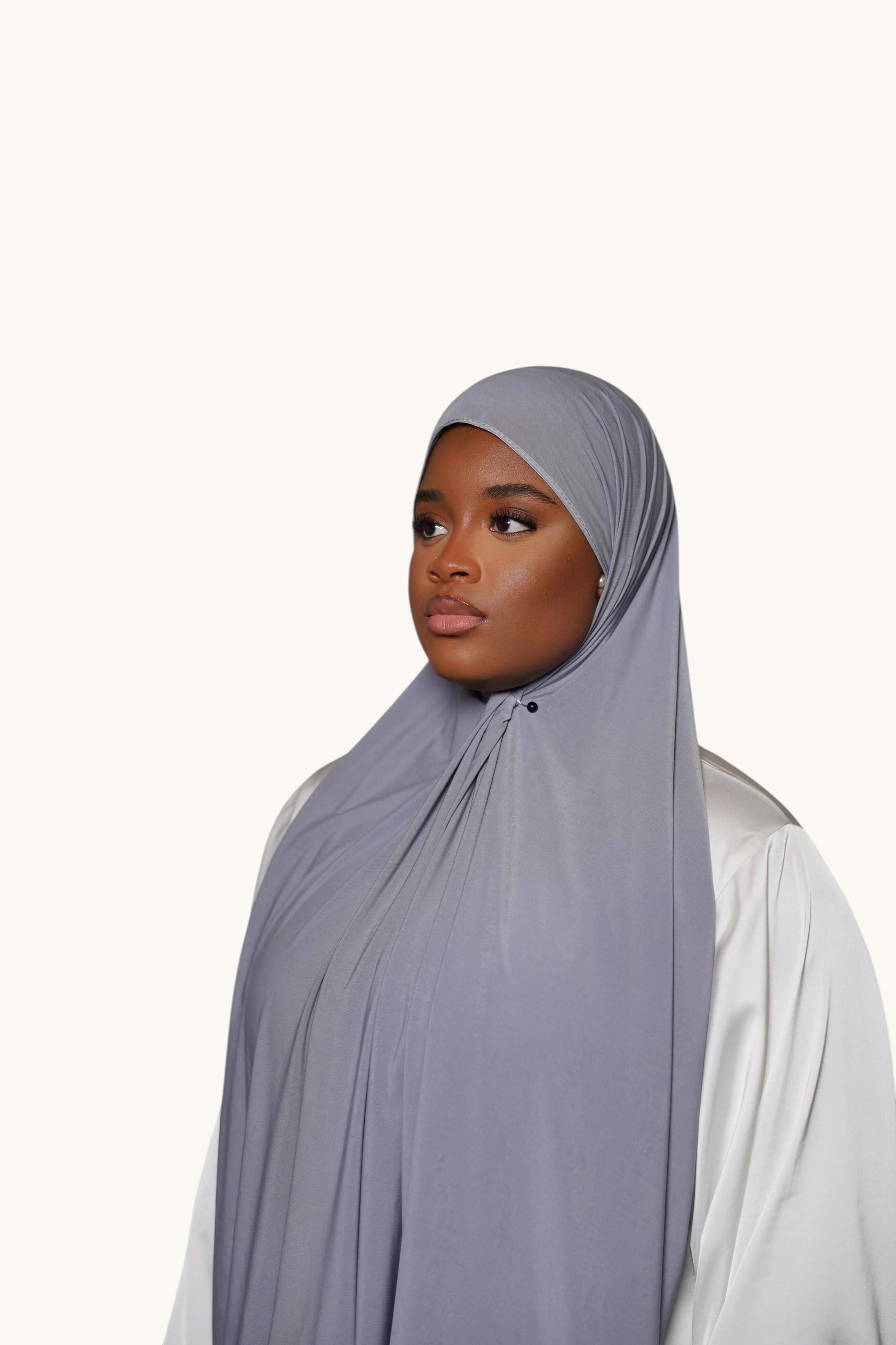 LOSYANA dark grey premium jersey hijab worn by a model, featuring soft, non-transparent, and non-slip fabric.