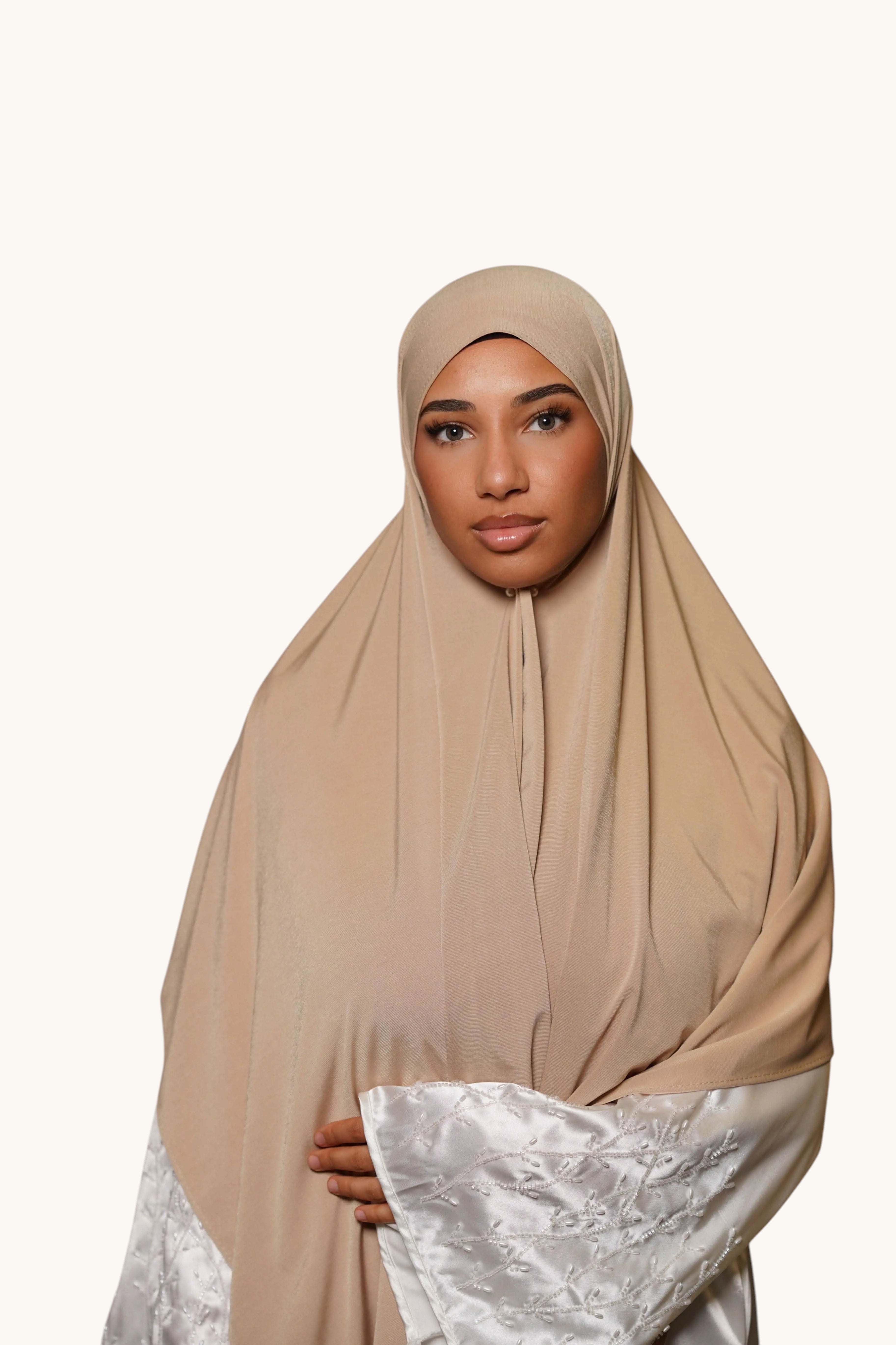 LOSYANA desert beige premium jersey hijab worn by a model, featuring a soft, opaque, and non-slip fabric.