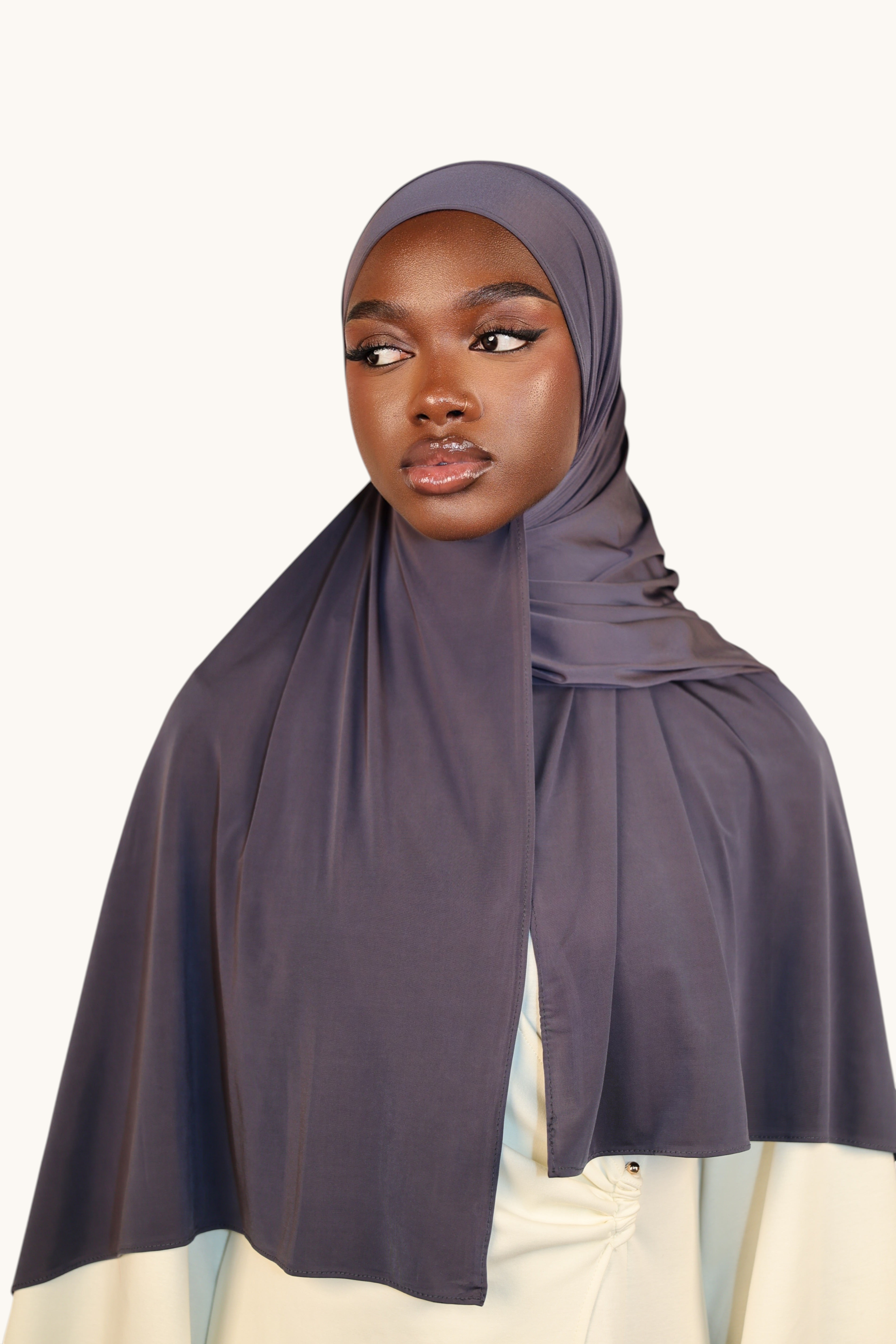 LOSYANA dusty blue liquid jersey hijab worn by a model, featuring a lightweight, elegant, and breathable fabric.