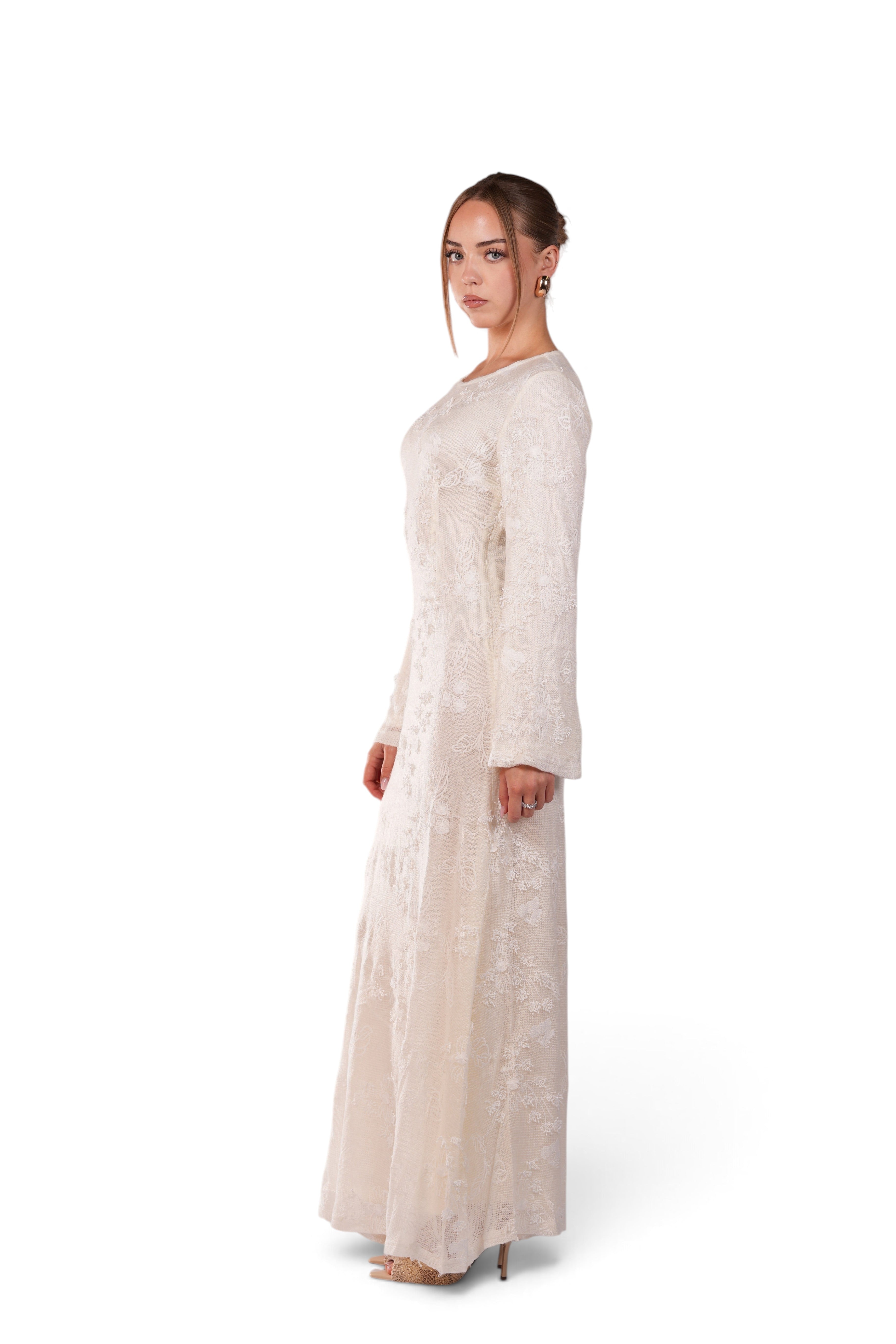 LOSYANA Fuerteventura elegant cream lace maxi dress with round neck and trumpet sleeves worn by a model