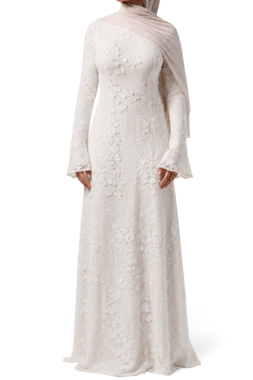 LOSYANA Fuerteventura elegant white lace maxi dress with trumpet sleeves and a matching hijab on a model