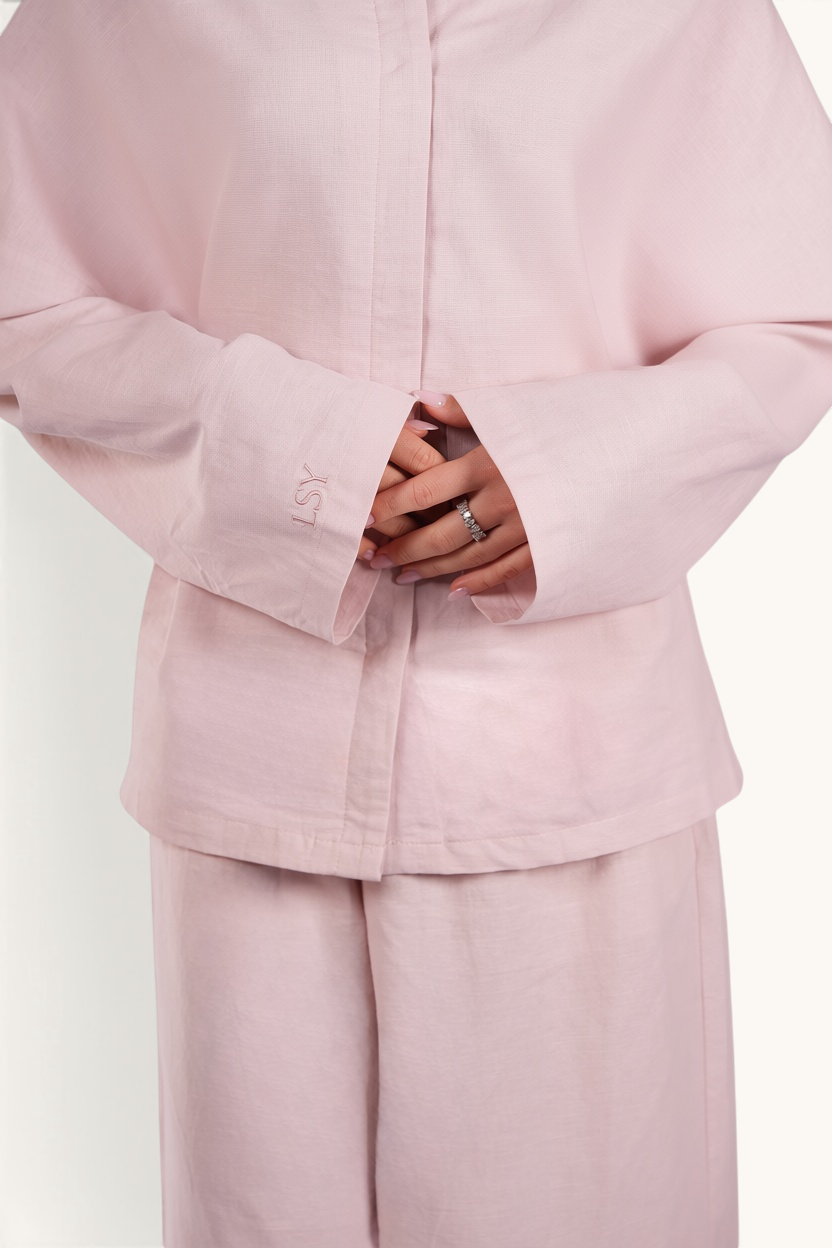 LOSYANA Gran Canaria almond linen two-piece set featuring a long-sleeved top with trumpet sleeves and LSY embroidery.