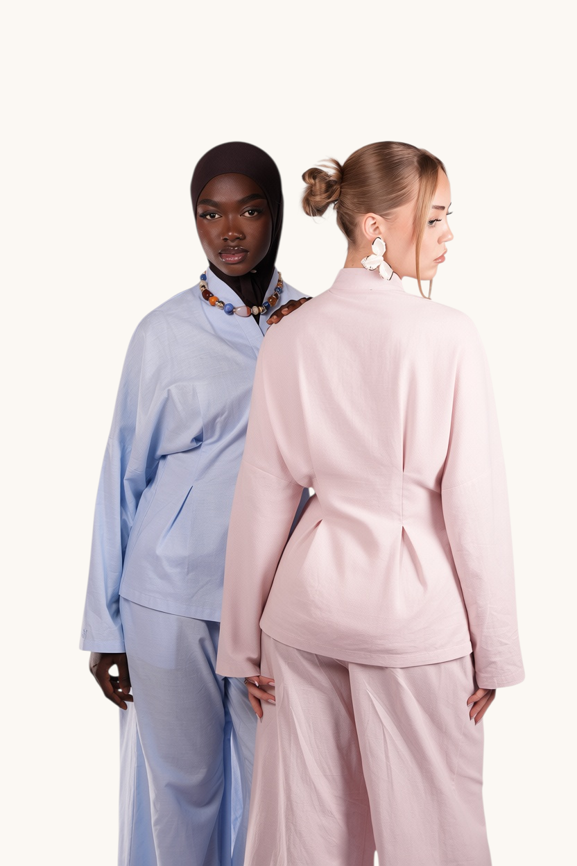 LOSYANA Gran Canaria linen two-piece sets in aqua and soft pink with trumpet sleeves and high collars on two models.