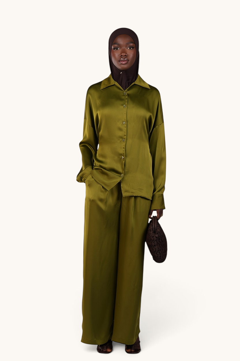 LOSYANA La Laguna lime green satin two-piece set featuring a button-down blouse and wide-leg trousers on a model.
