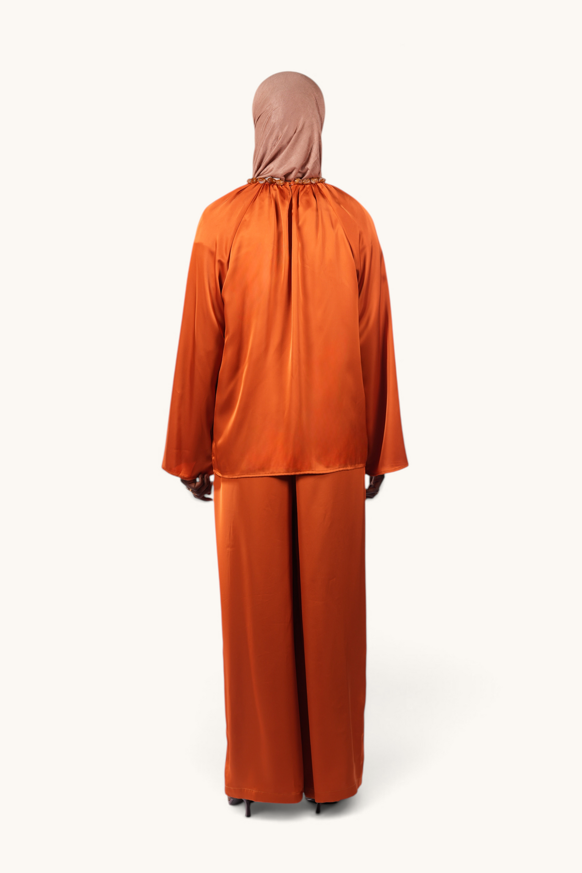 LOSYANA La Marina papaya satin two-piece set with wide-leg trousers and long-sleeved top, back view