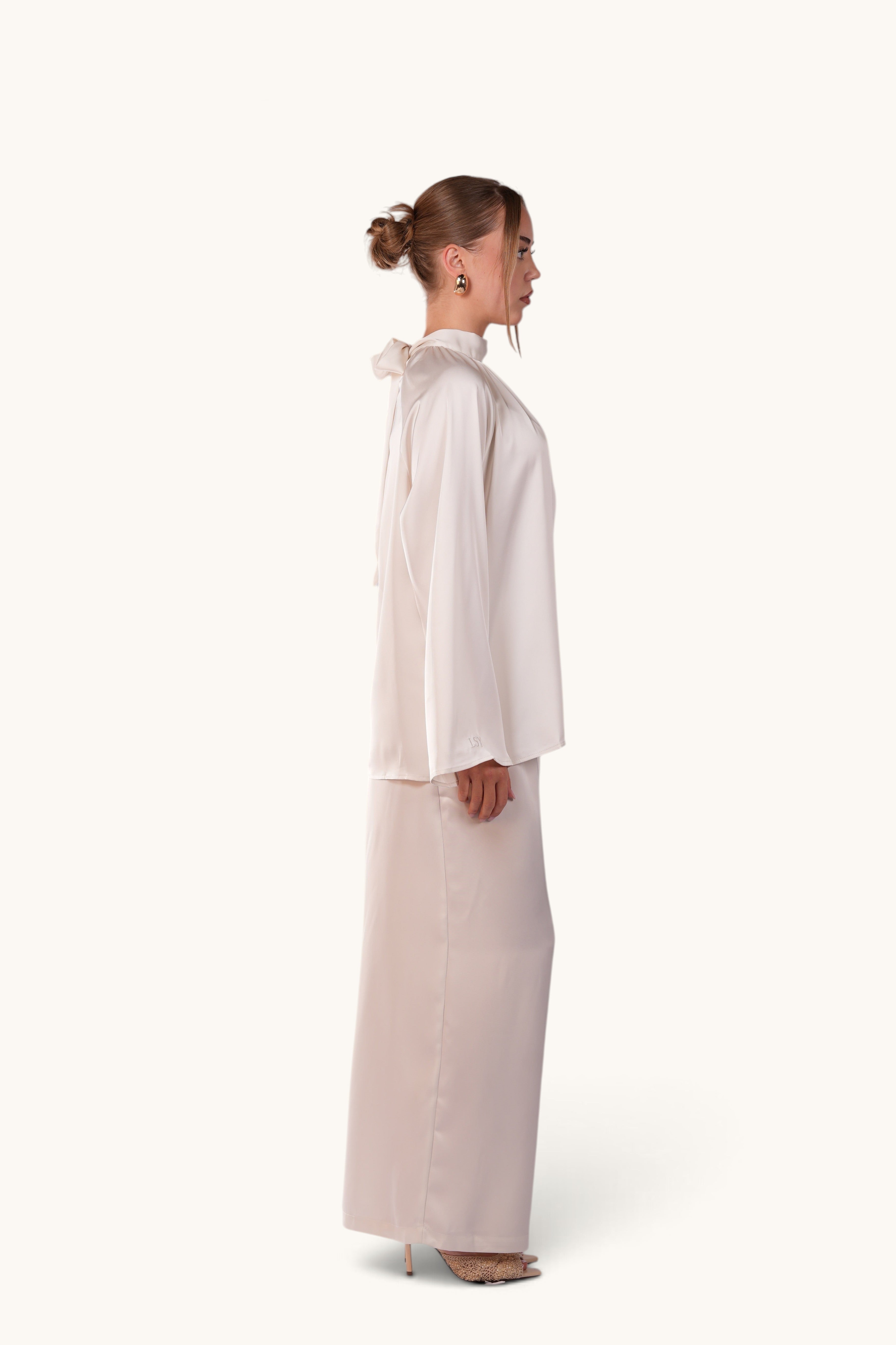 LOSYANA La Palma white satin two-piece set featuring a high-neck top with back bow tie and wide-leg trousers
