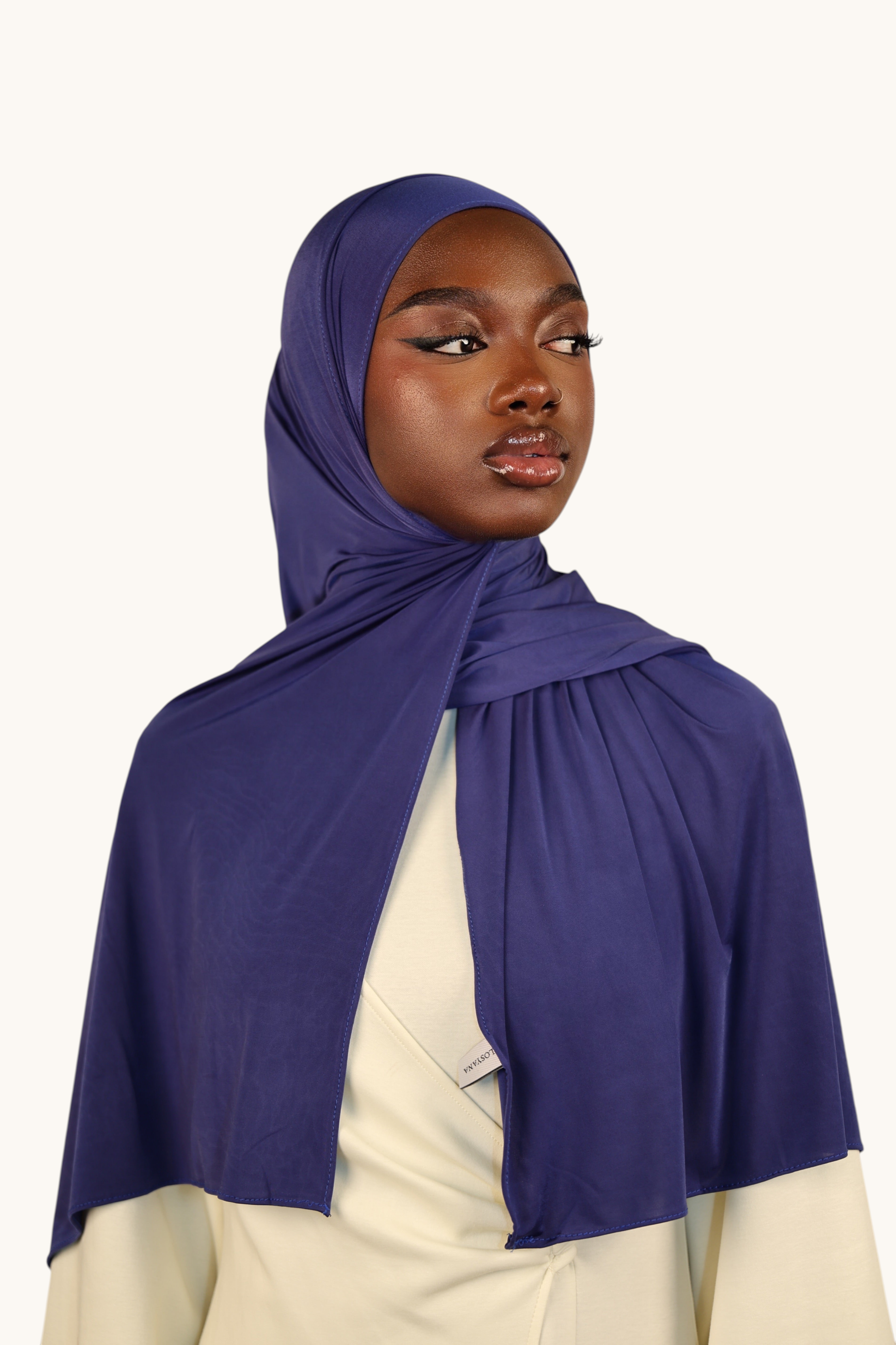 LOSYANA Liquid Jersey hijab in sapphire blue, featuring a lightweight, slightly glossy fabric on a model.