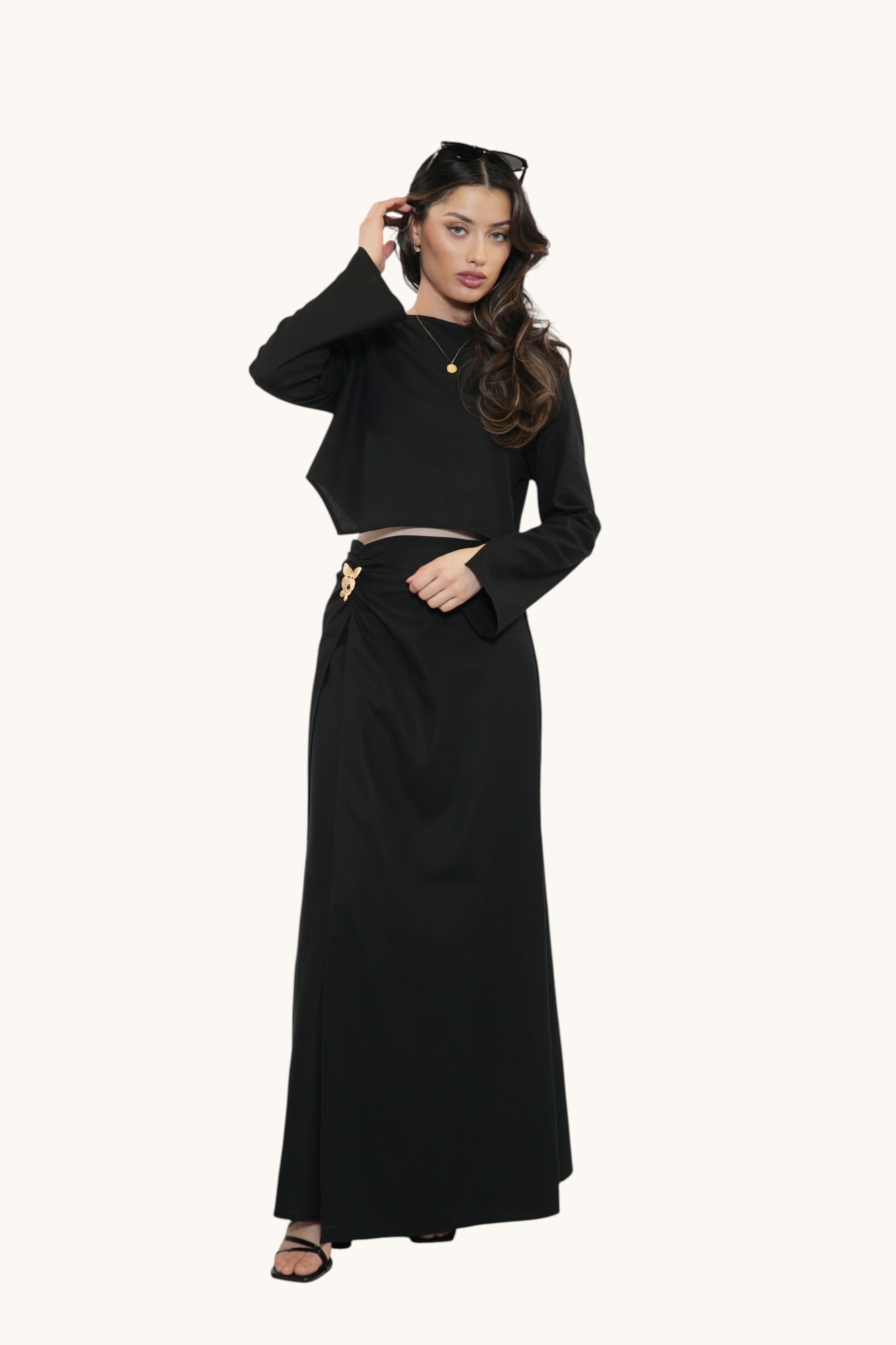 LOSYANA Mediterrance Serenity Set in black featuring a cropped long-sleeve top and a matching maxi skirt on a model.