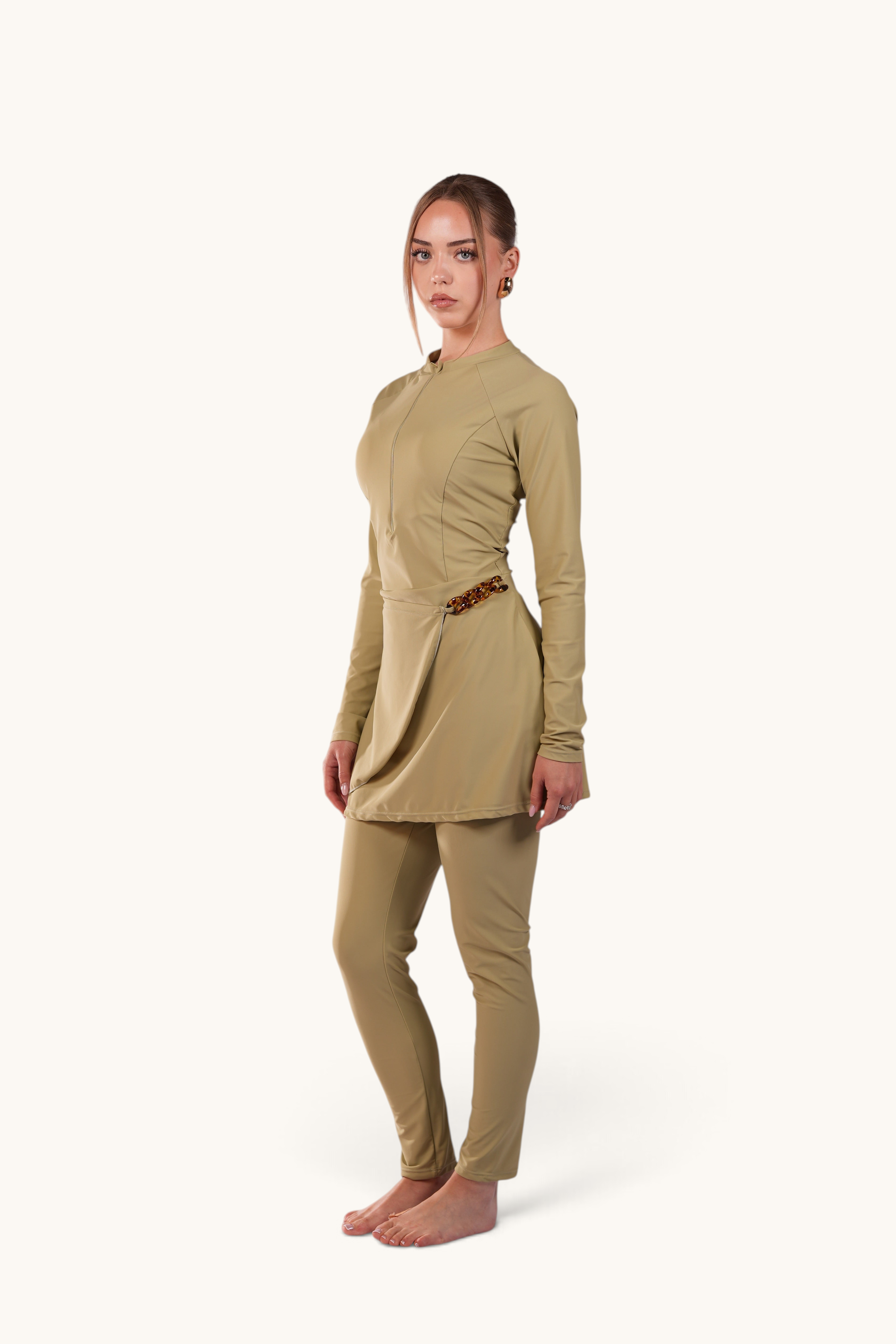 LOSYANA Costa del Sol pistachio green burkini with long-sleeve zip top, leggings, and elegant hip chain detail.