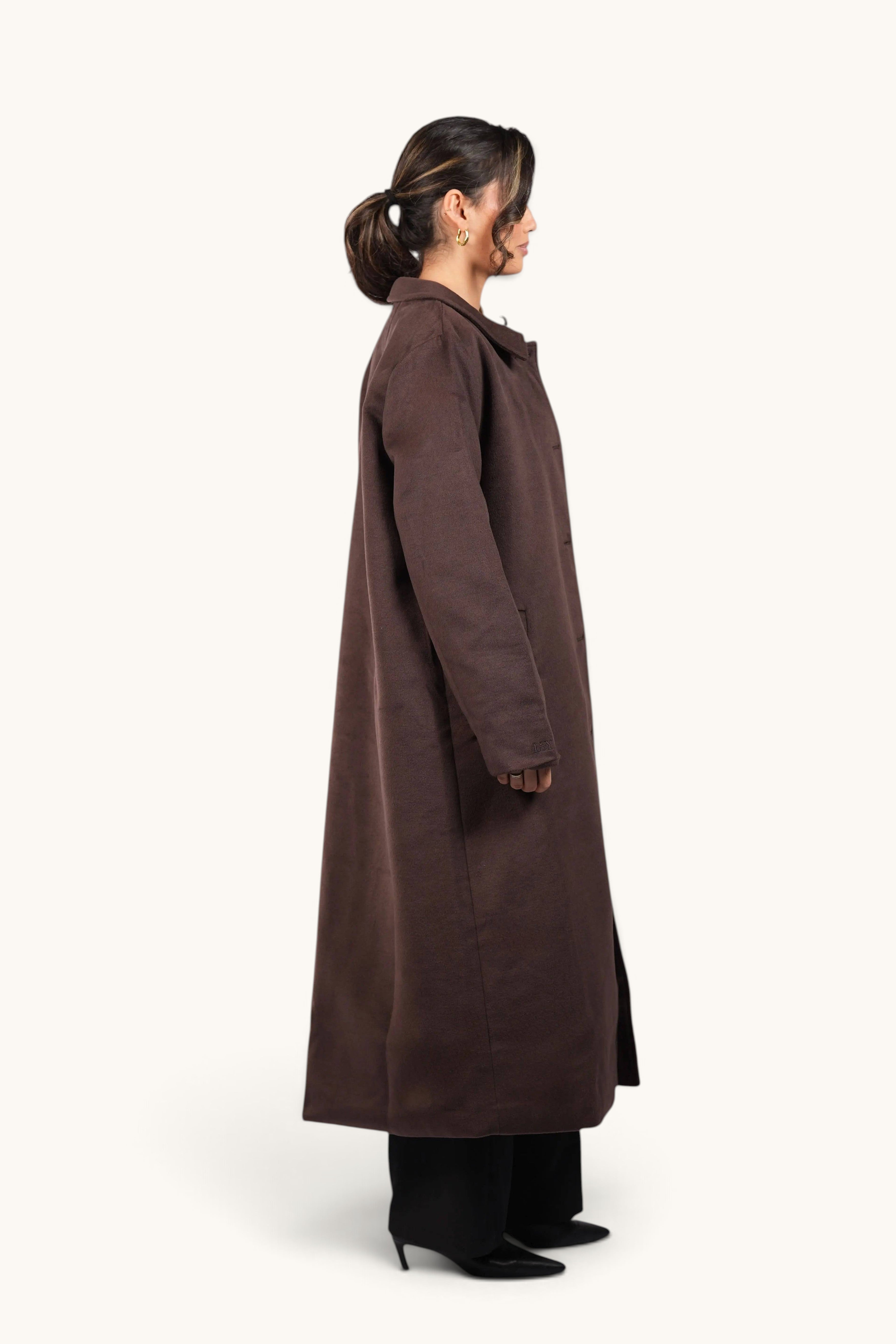 Model wearing LOSYANA The Vienna Coat in espresso brown, a long elegant winter coat with a classic collar.