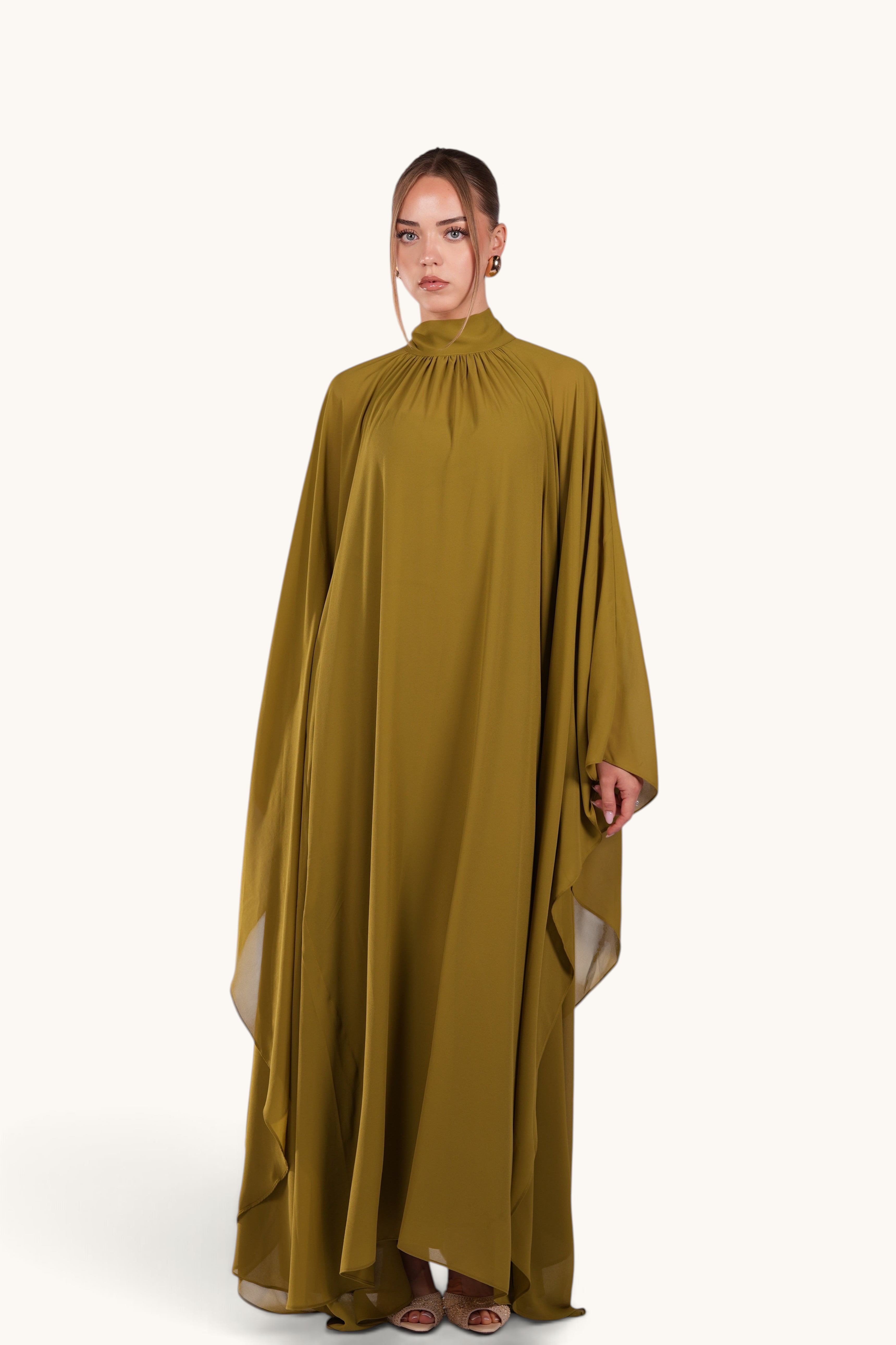 LOSYANA Andalusia lime green chiffon cape dress with a high neckline and flowing silhouette worn by a model