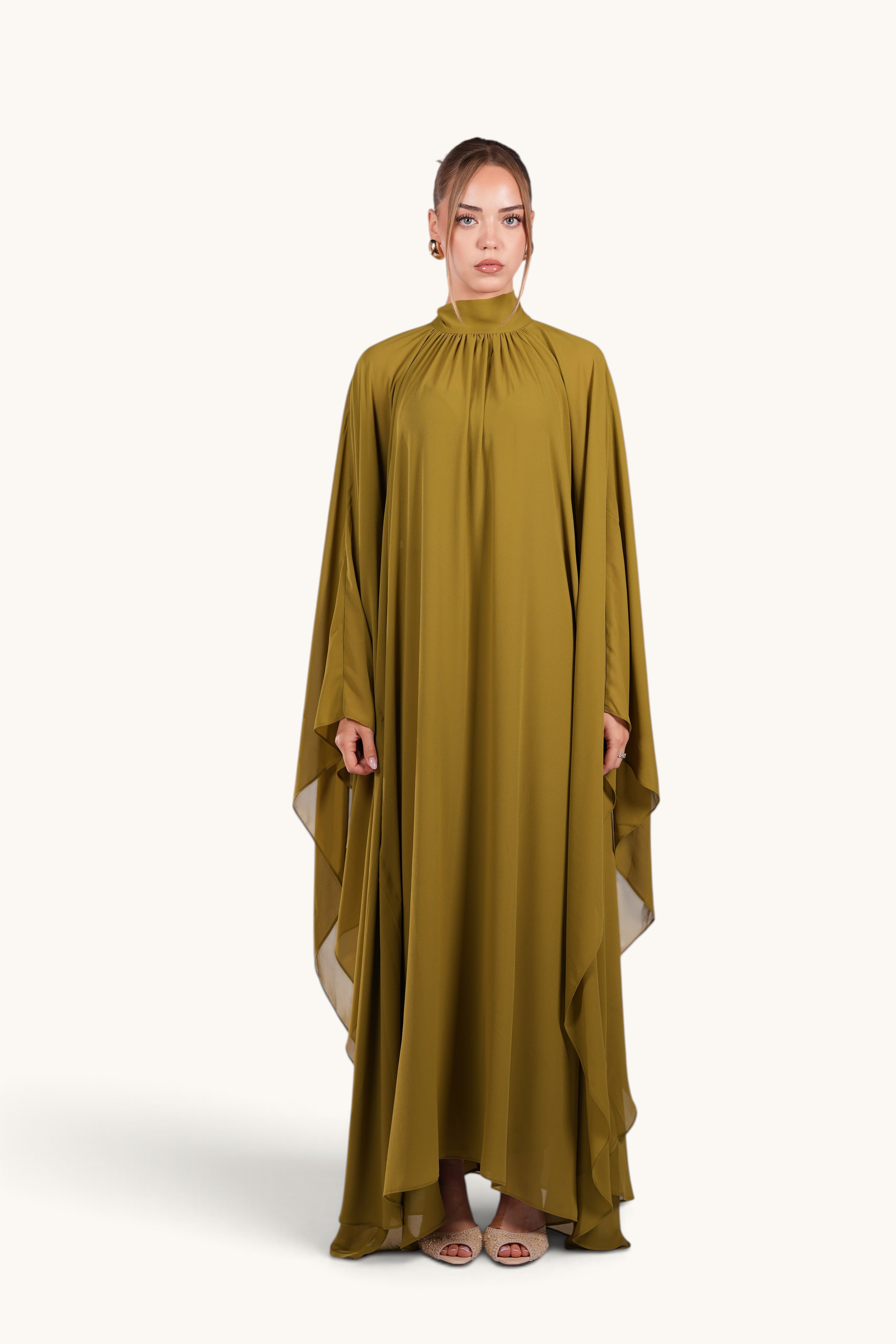 LOSYANA Andalusia lime green chiffon cape dress with high neckline worn by a model on a white background