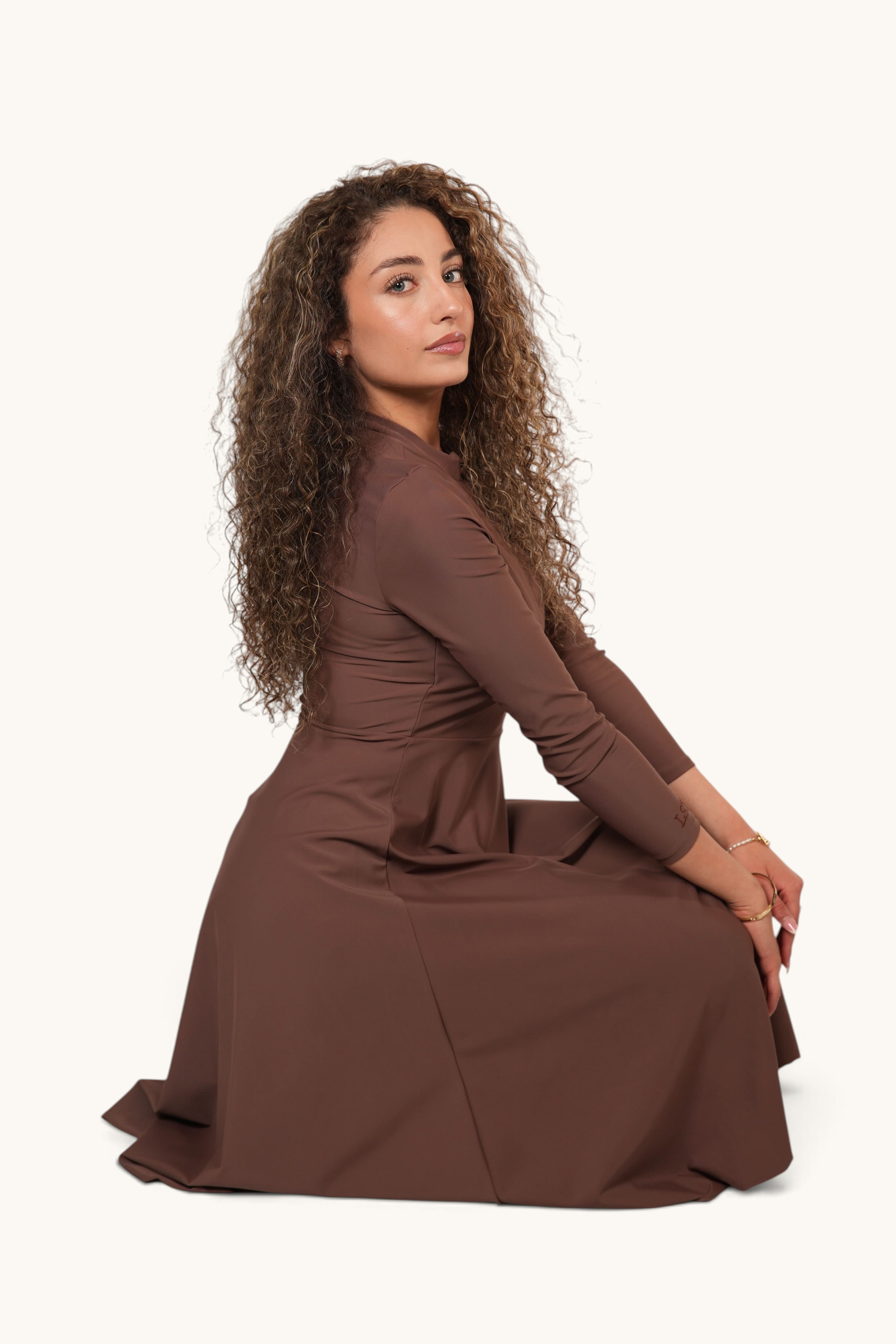LOSYANA Azzurra long brown burkini set worn by a woman with curly hair, featuring quick-dry and UV-protective fabric.