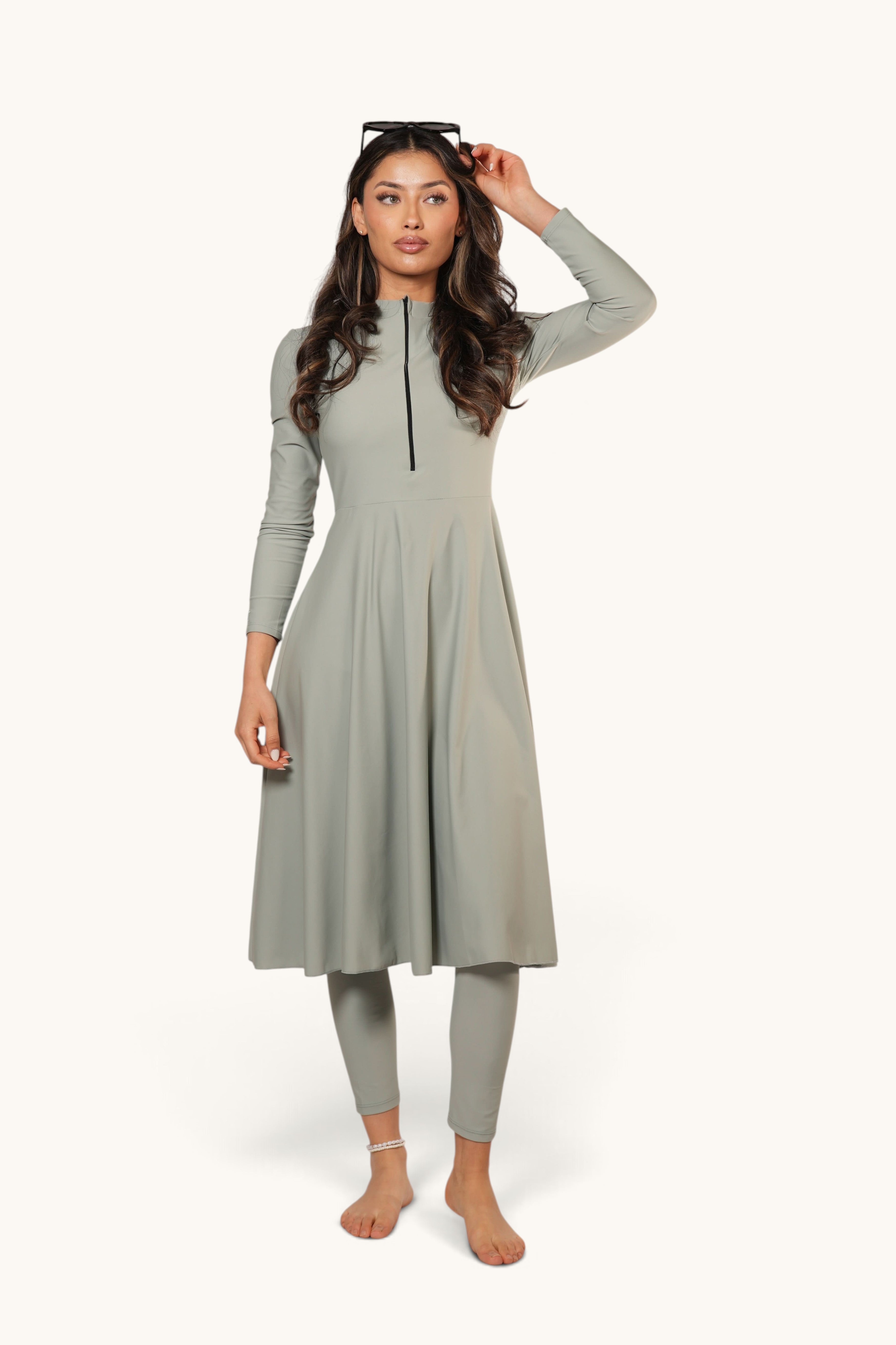 LOSYANA Azzurra mint green long-sleeve burkini set with a zip-front tunic and matching leggings on a model