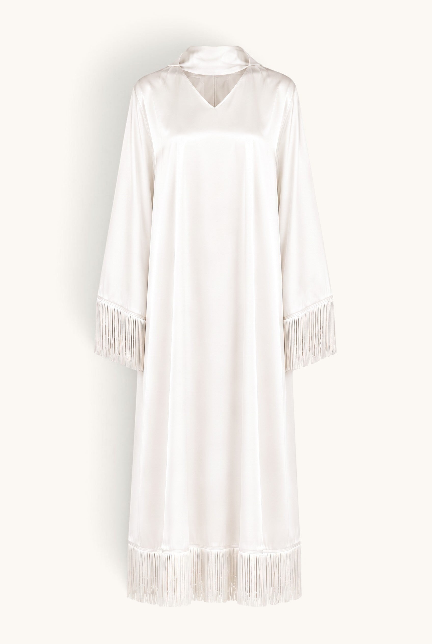LOSYANA Barcelona white satin midi dress with fringe trim on sleeves and hem, featuring a V-neck and scarf detail.