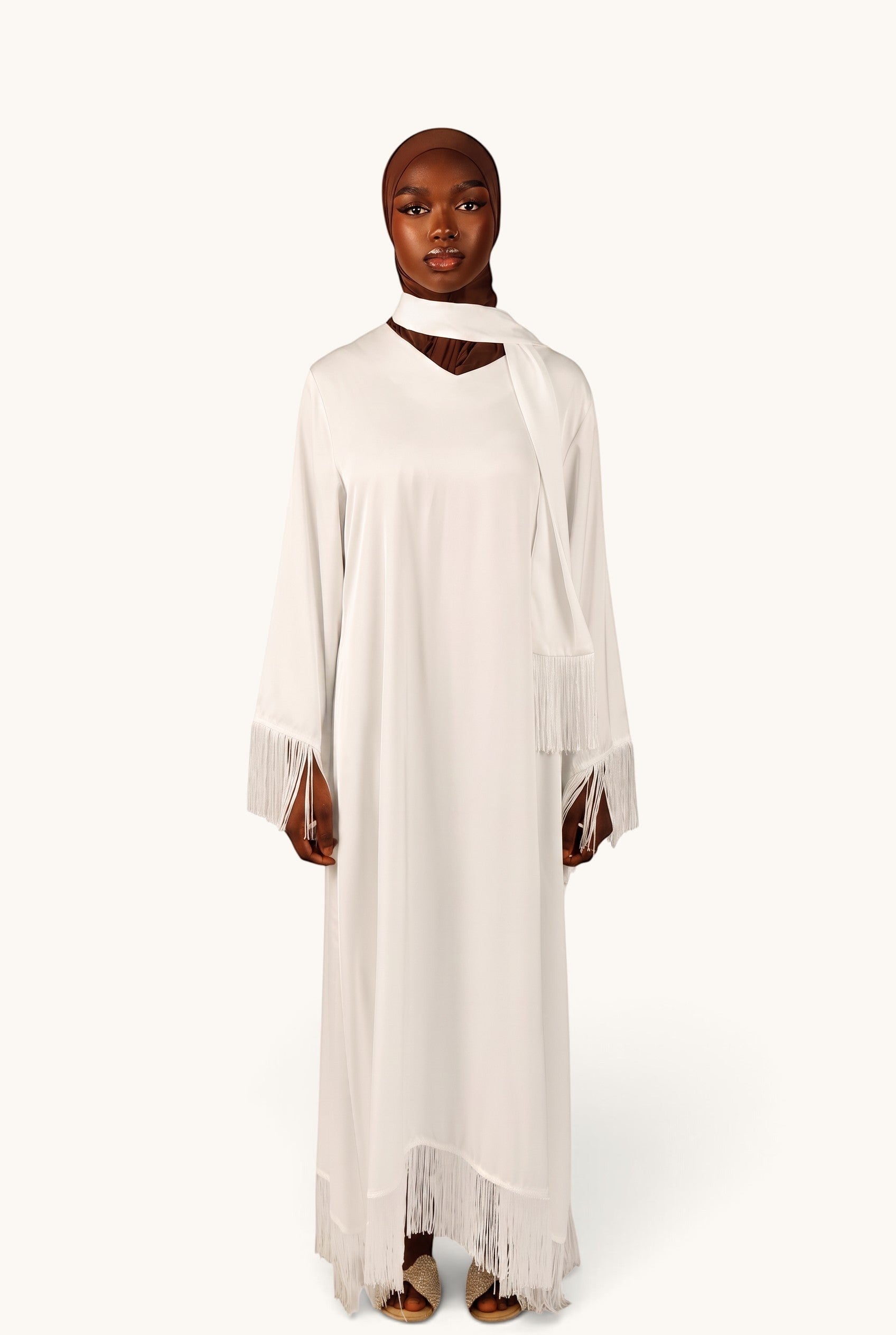LOSYANA Barcelona white satin dress with fringe trim on sleeves and hem, featuring a matching scarf detail.