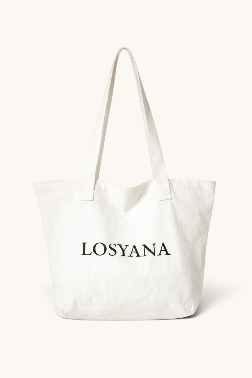 LOSYANA beige cotton canvas tote bag with minimalist black logo print, ideal for daily use and sustainable shopping.