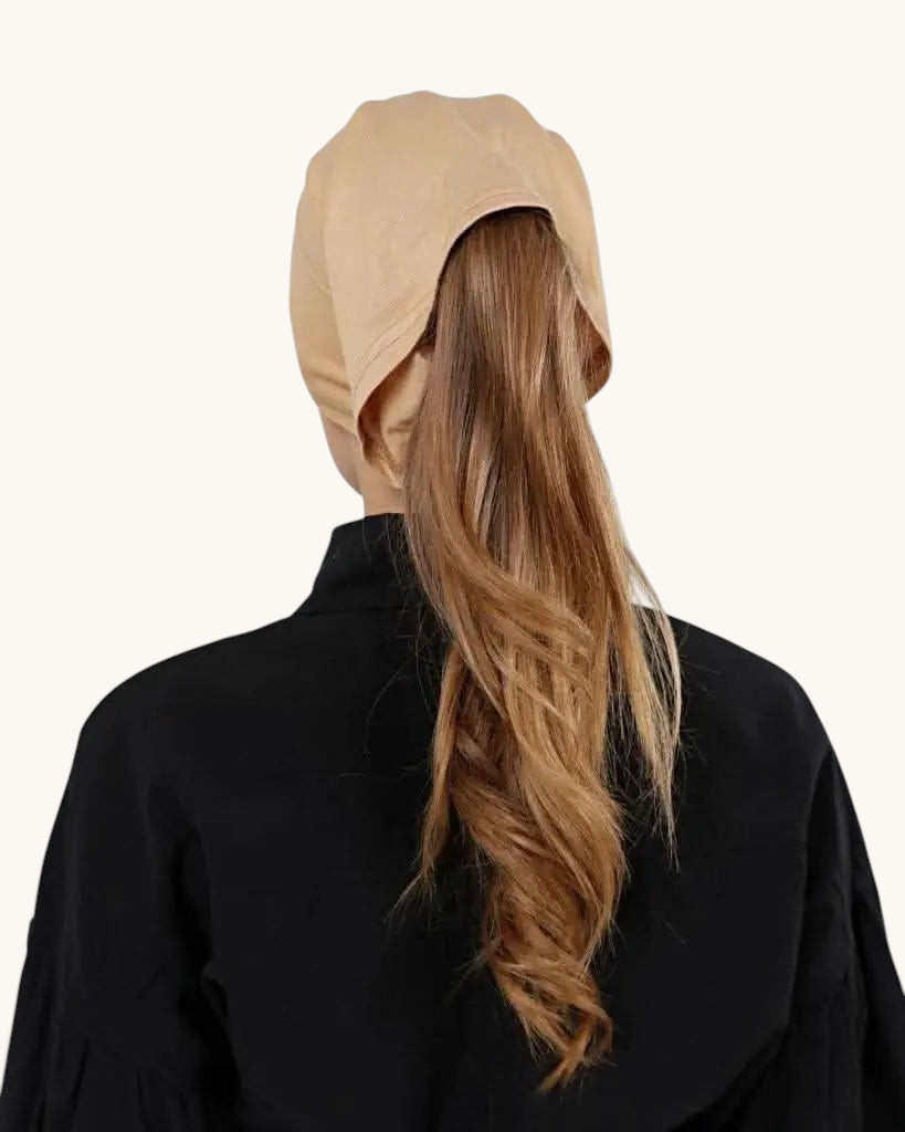 LOSYANA beige open-back underscarf worn by a woman with long hair, designed for comfort under a hijab.