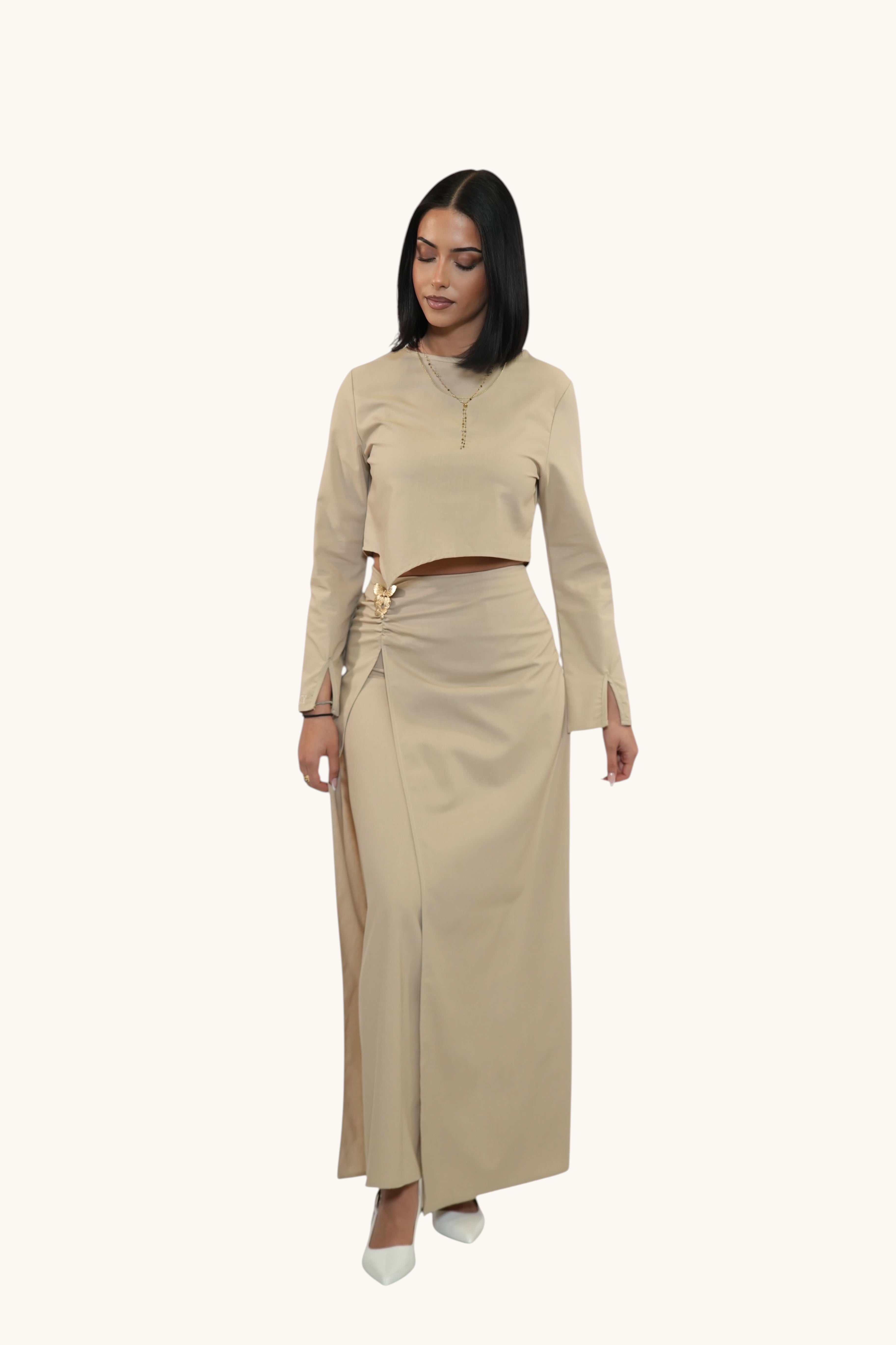 LOSYANA beige Mediterrance Serenity set featuring a long-sleeve crop top and matching maxi skirt with gold detail.