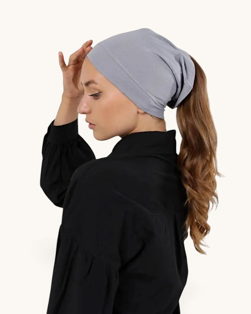 LOSYANA bone grey open-back underscarf worn by a woman with a ponytail for comfortable hijab styling