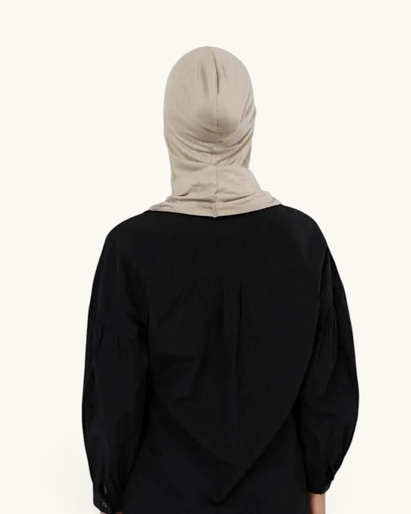 LOSYANA bone coloured ninja underscarf worn by a person in a black shirt, back view