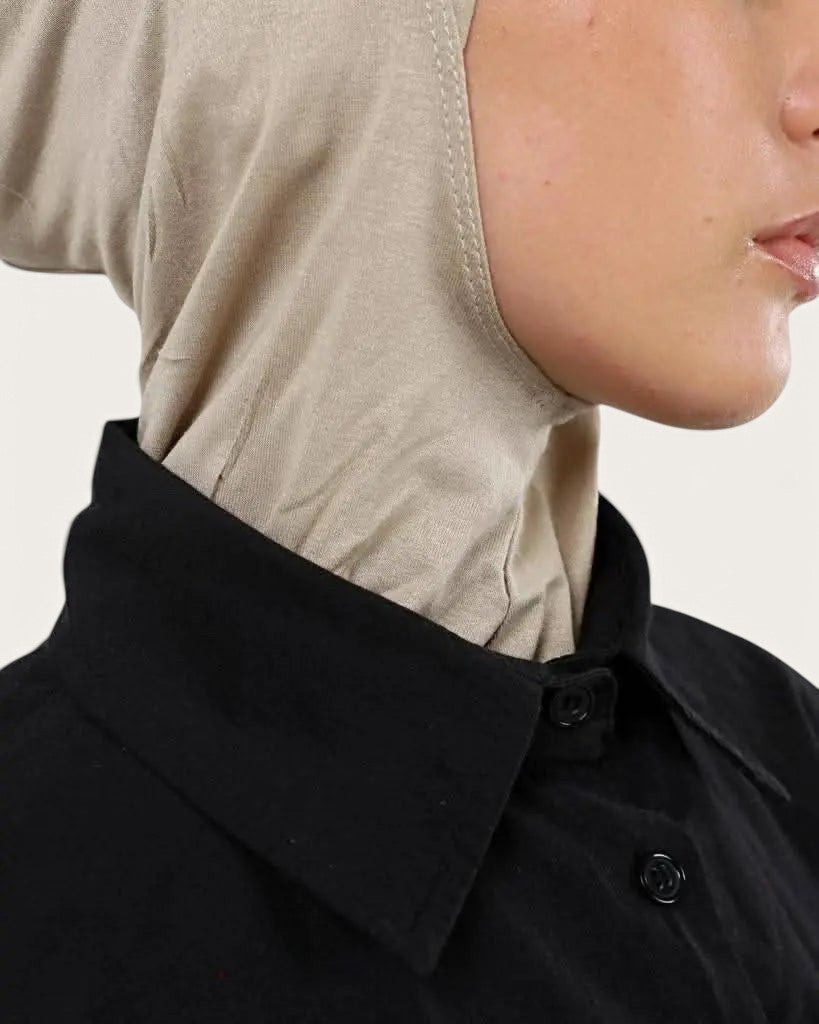LOSYANA bone-colored ninja underscarf worn by a model under a black collared shirt