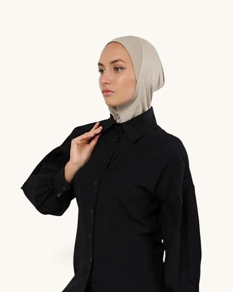 LOSYANA bone coloured ninja underscarf worn by a model in a black button-down shirt against a plain background