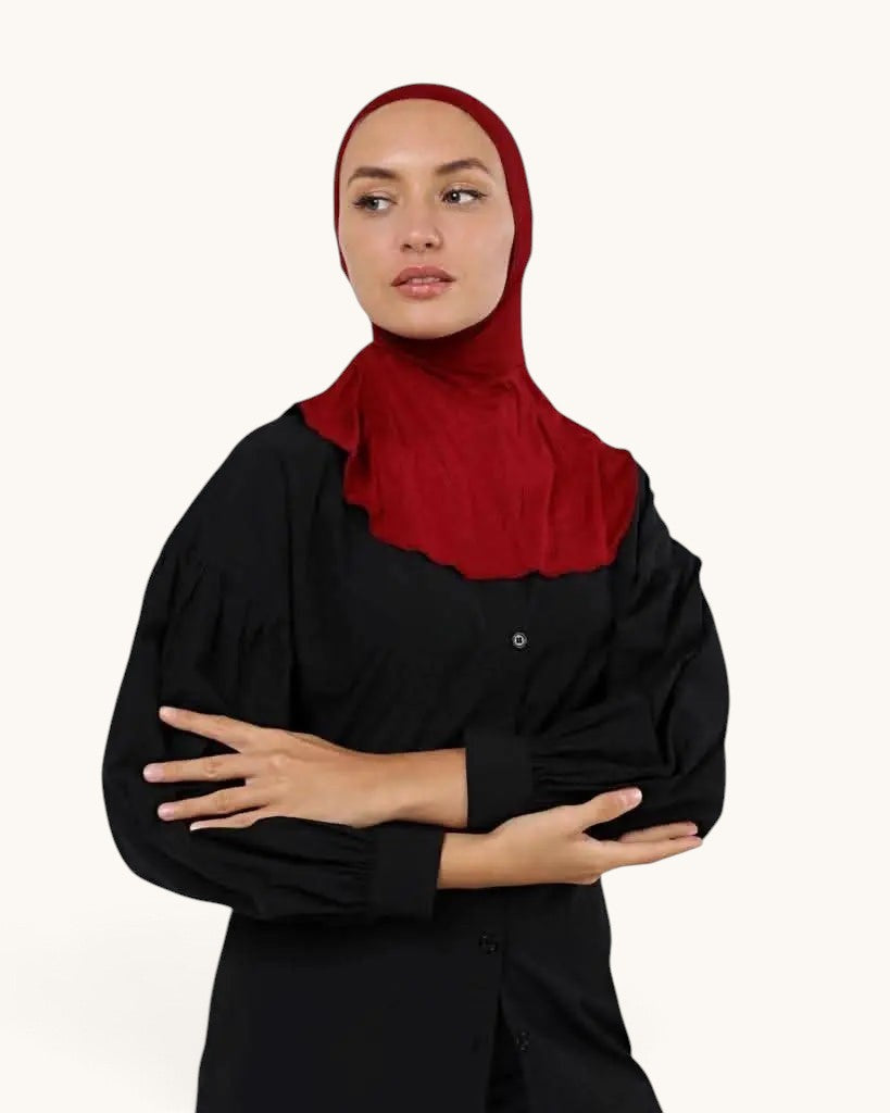 LOSYANA bone underscarf in deep red worn by a model under a black shirt for comfortable hijab styling