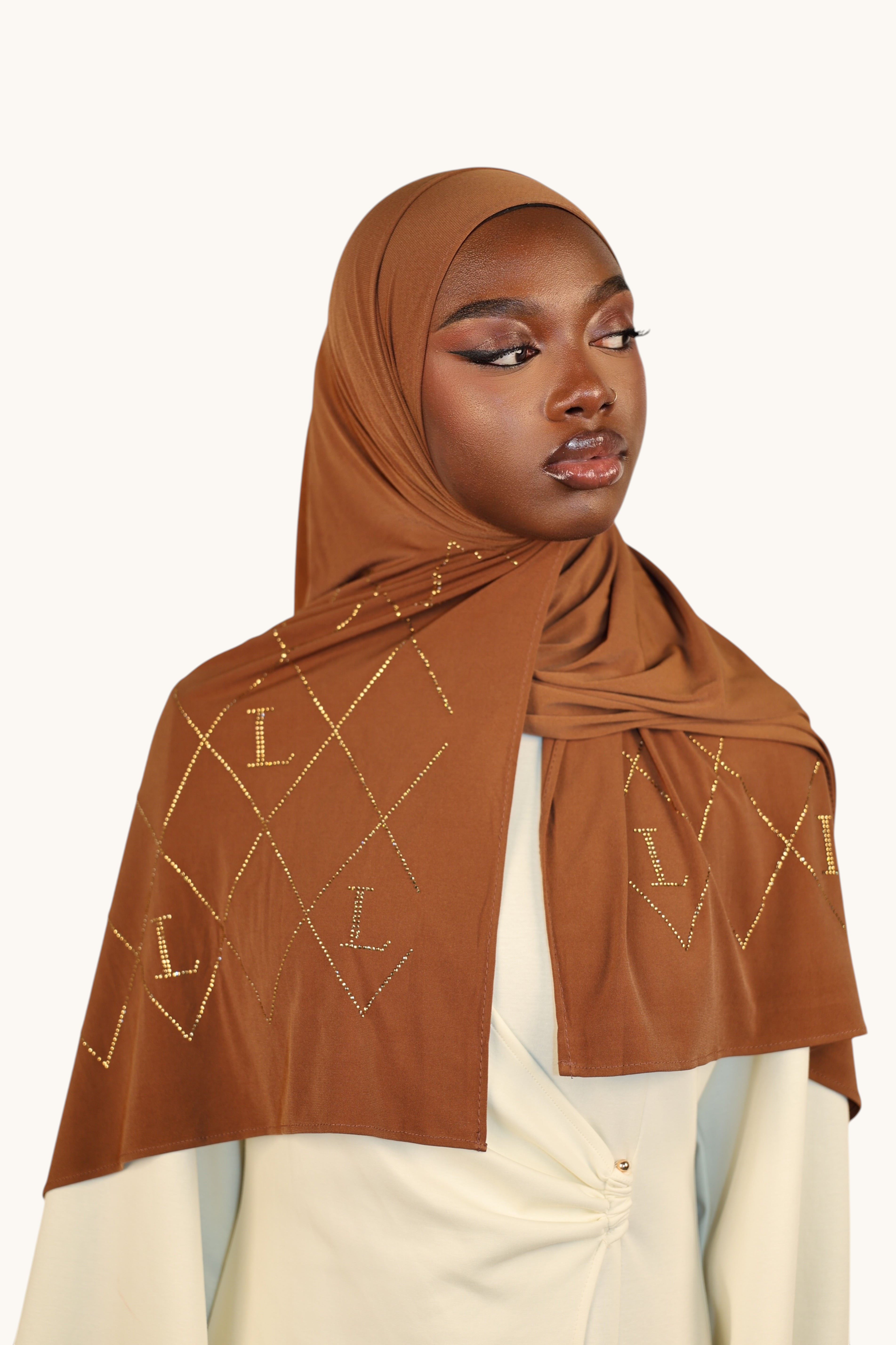 LOSYANA bronze premium jersey hijab featuring a sparkling rhinestone L-pattern and diamond grid design
