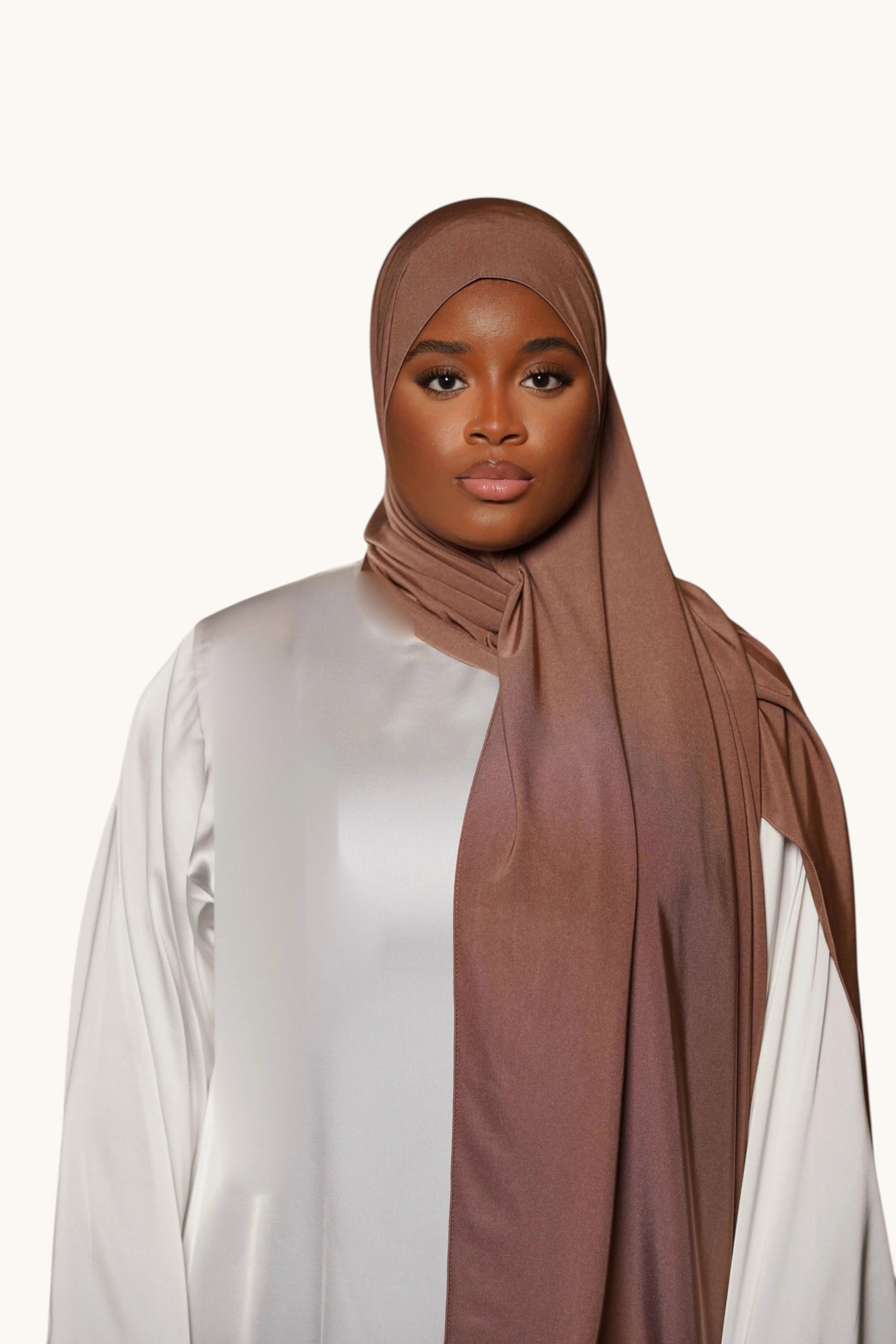 Model wearing a LOSYANA burnt sugar satin premium jersey hijab, featuring a non-slip, opaque fabric with elegant drape.