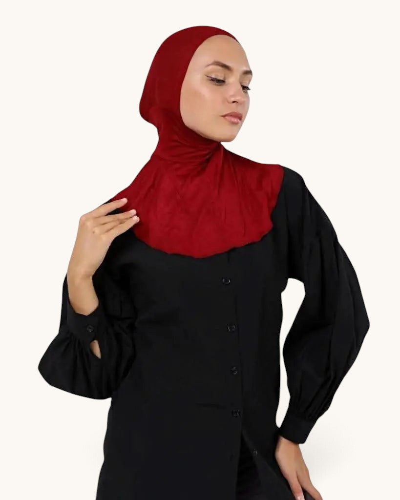 LOSYANA dark red underscarf worn by a model to provide comfort and hair protection under a hijab.
