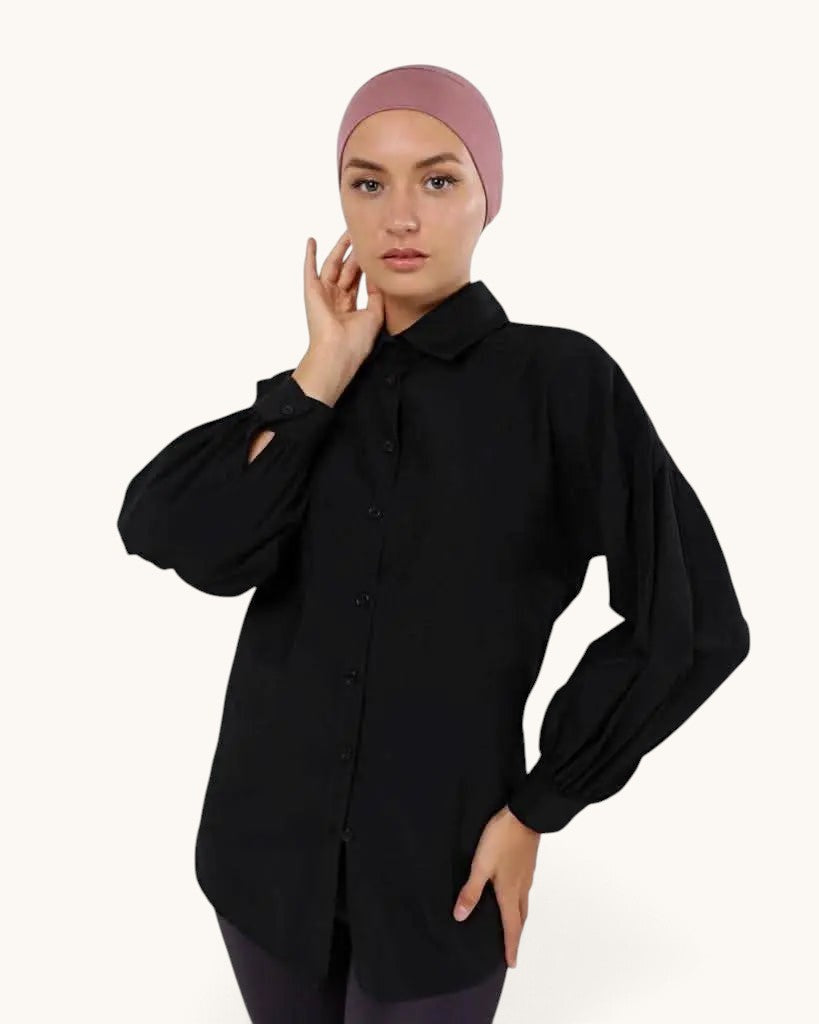 Model wearing a dusty pink LOSYANA basic closed underscarf with a black button-down shirt