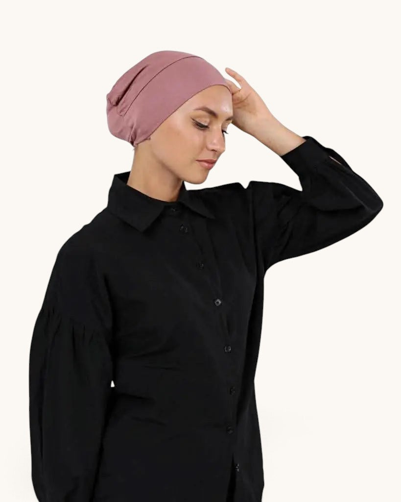 Model wearing a dusty rose LOSYANA basic closed underscarf with a black button-down shirt