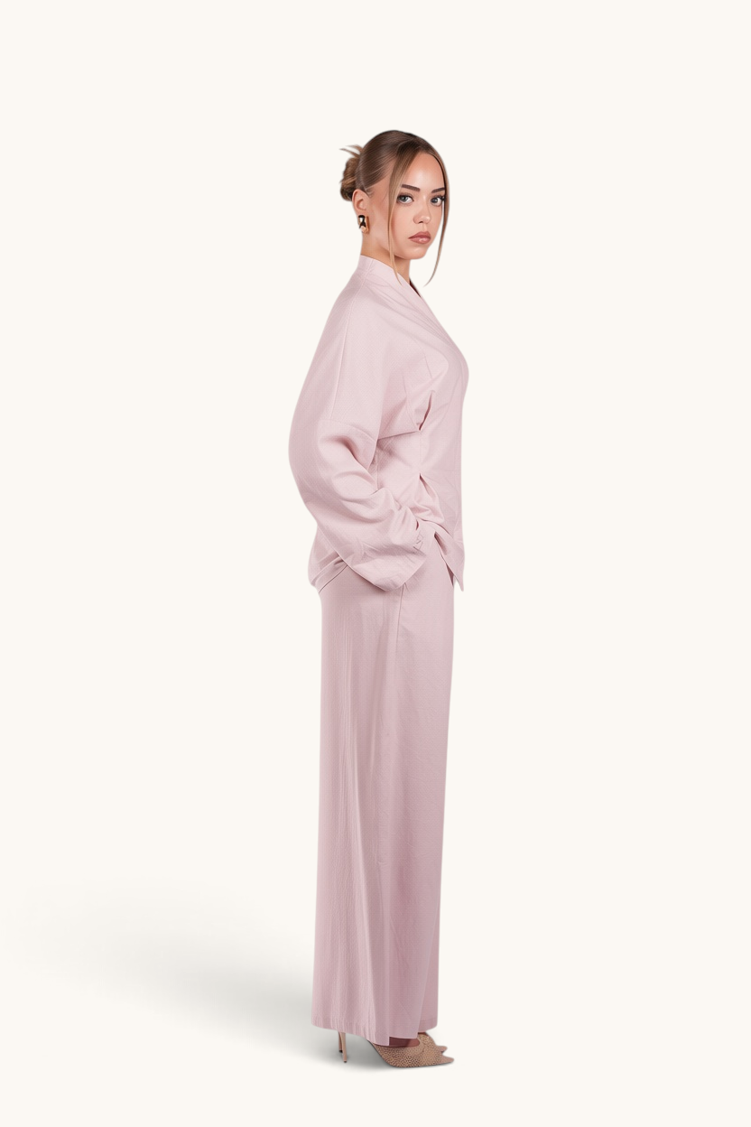 LOSYANA Gran Canaria almond linen two-piece set with wide-leg trousers and trumpet-sleeve top on a model.
