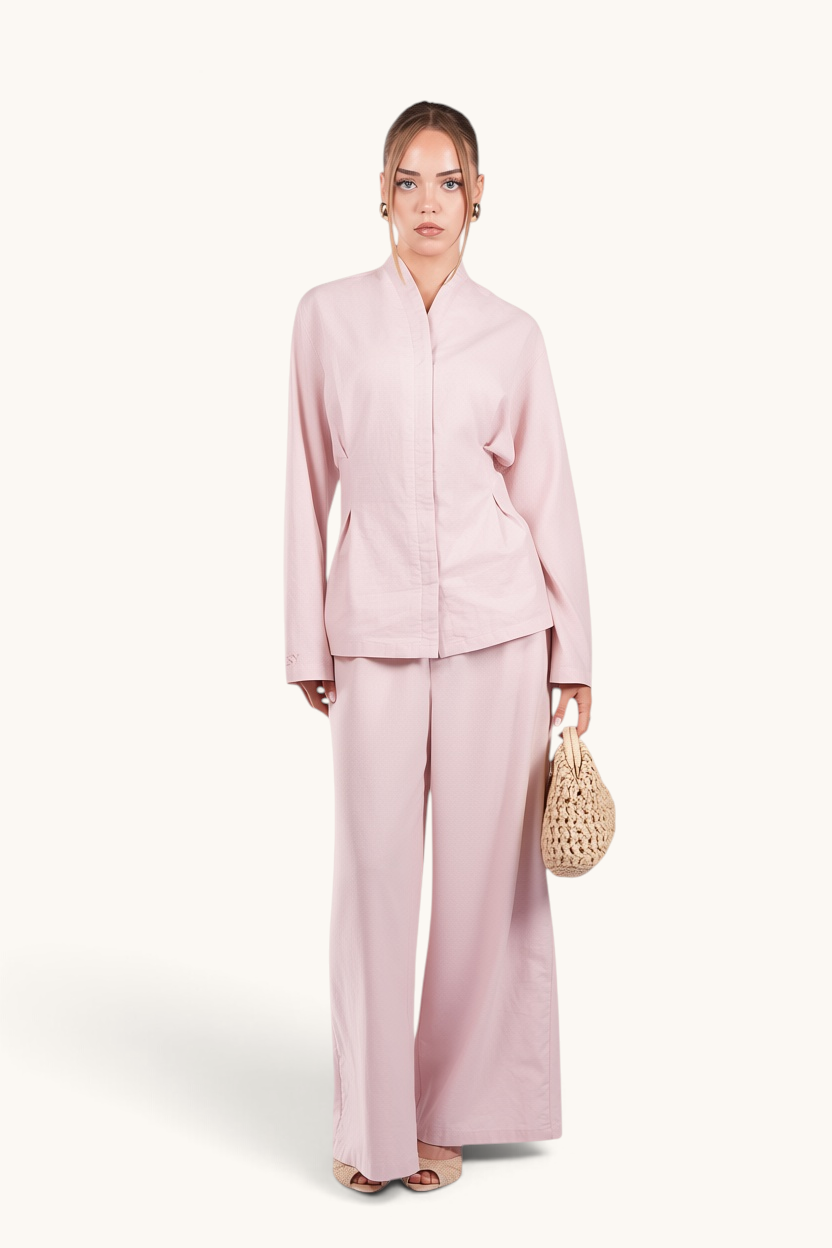 LOSYANA Gran Canaria almond linen two-piece set with wide-leg trousers and trumpet sleeve top on a female model