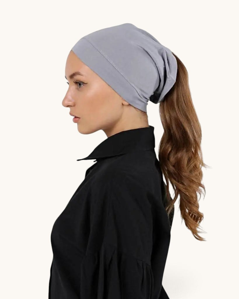 LOSYANA bone grey open-back underscarf worn by a woman with a ponytail for comfortable hijab styling