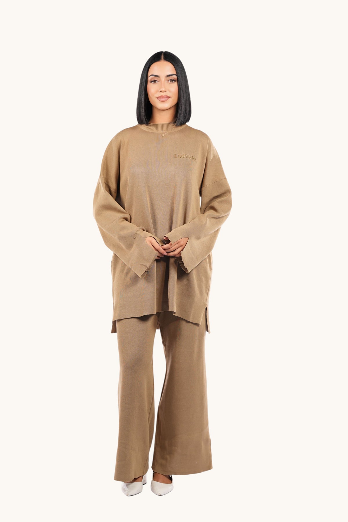 Model wearing a LOSYANA khaki oversized cotton sweater and matching wide-leg trousers in a minimalist style.