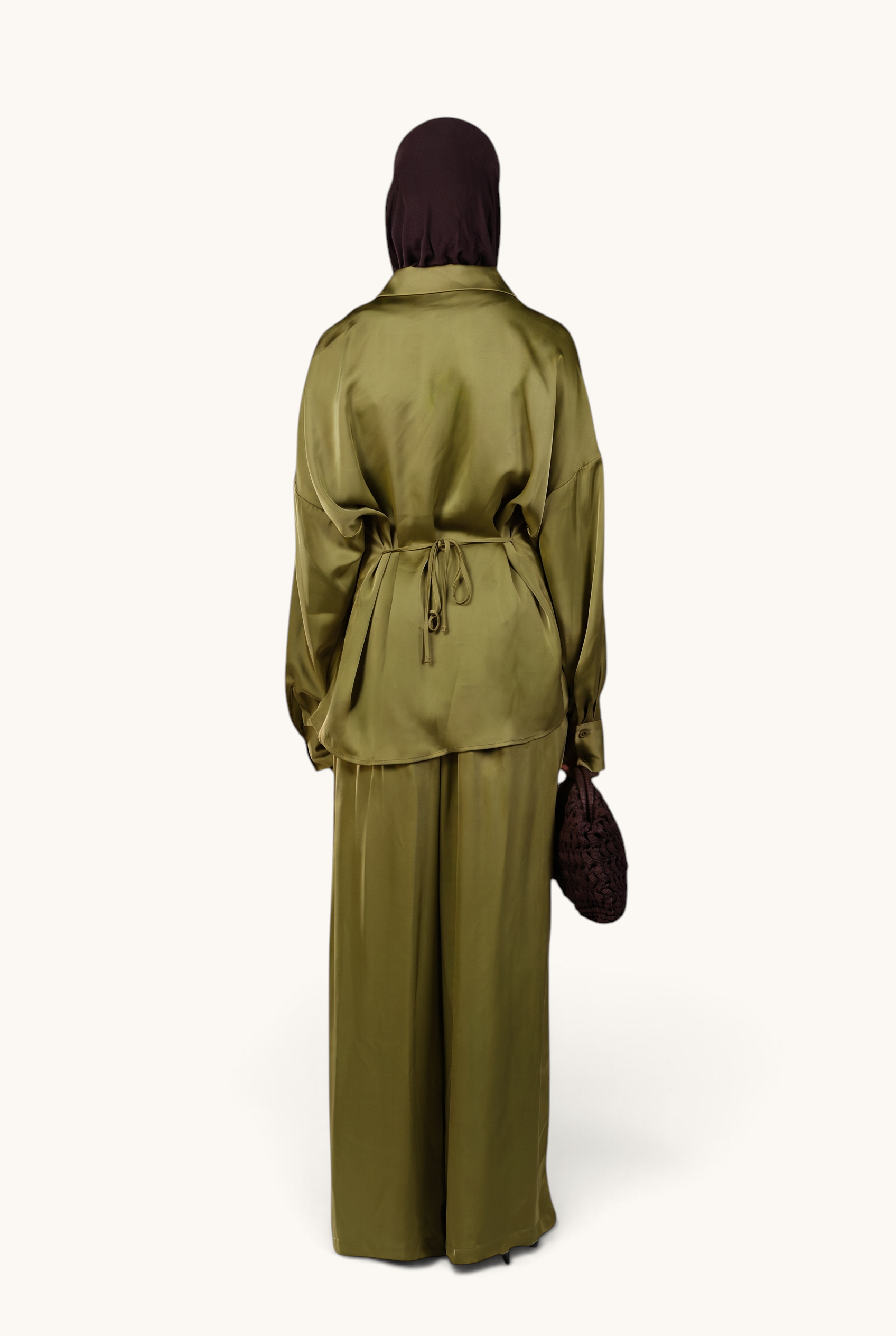 LOSYANA La Laguna satin two-piece set in soft thyme green with a tie-waist blouse and wide-leg trousers, back view.