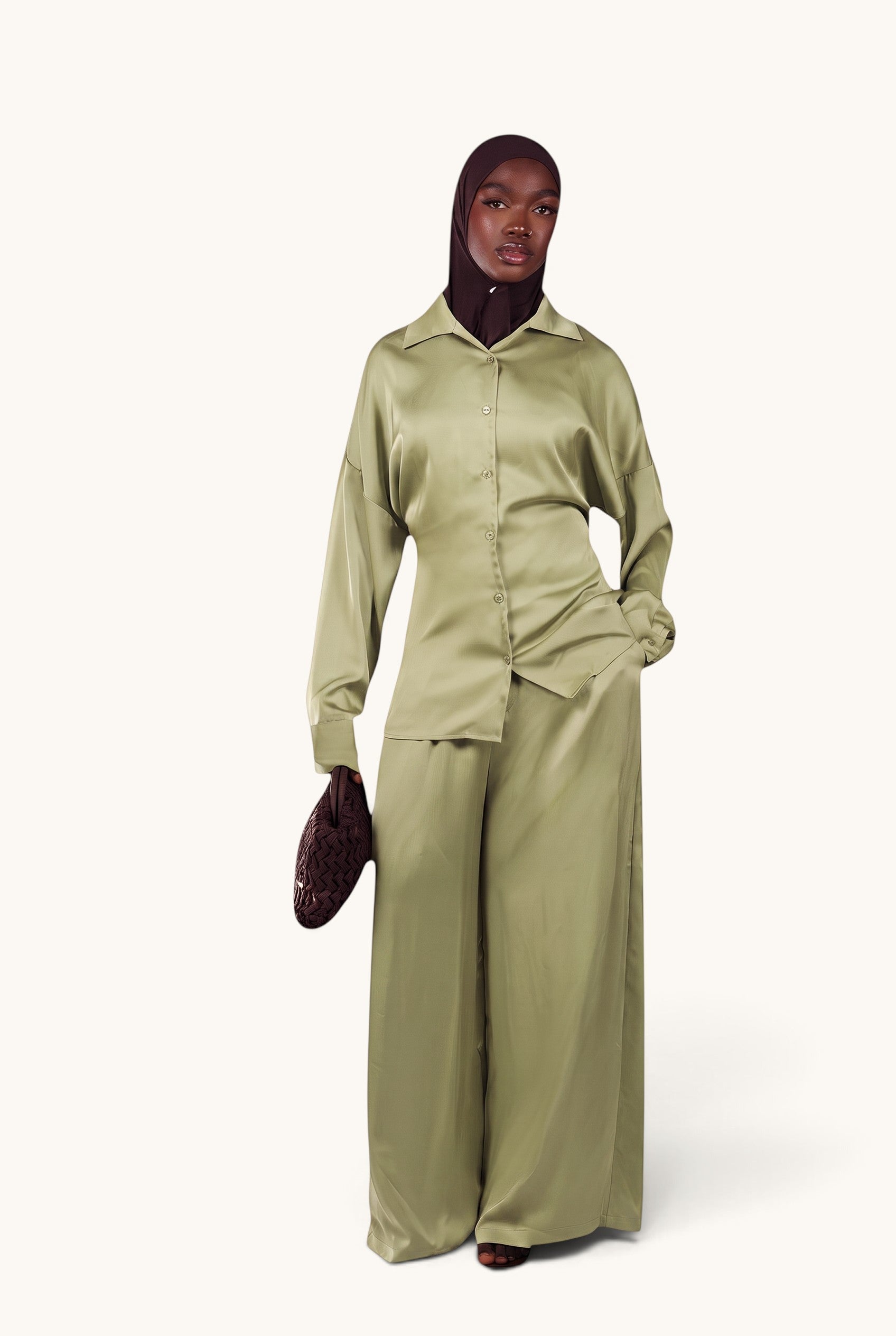 LOSYANA La Laguna satin two-piece set in soft thyme with a button-down blouse and wide-leg trousers on a model.