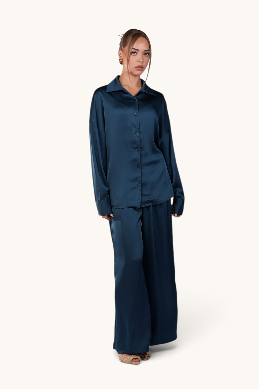 LOSYANA La Laguna teal satin two-piece set featuring a button-down blouse and wide-leg trousers on a model