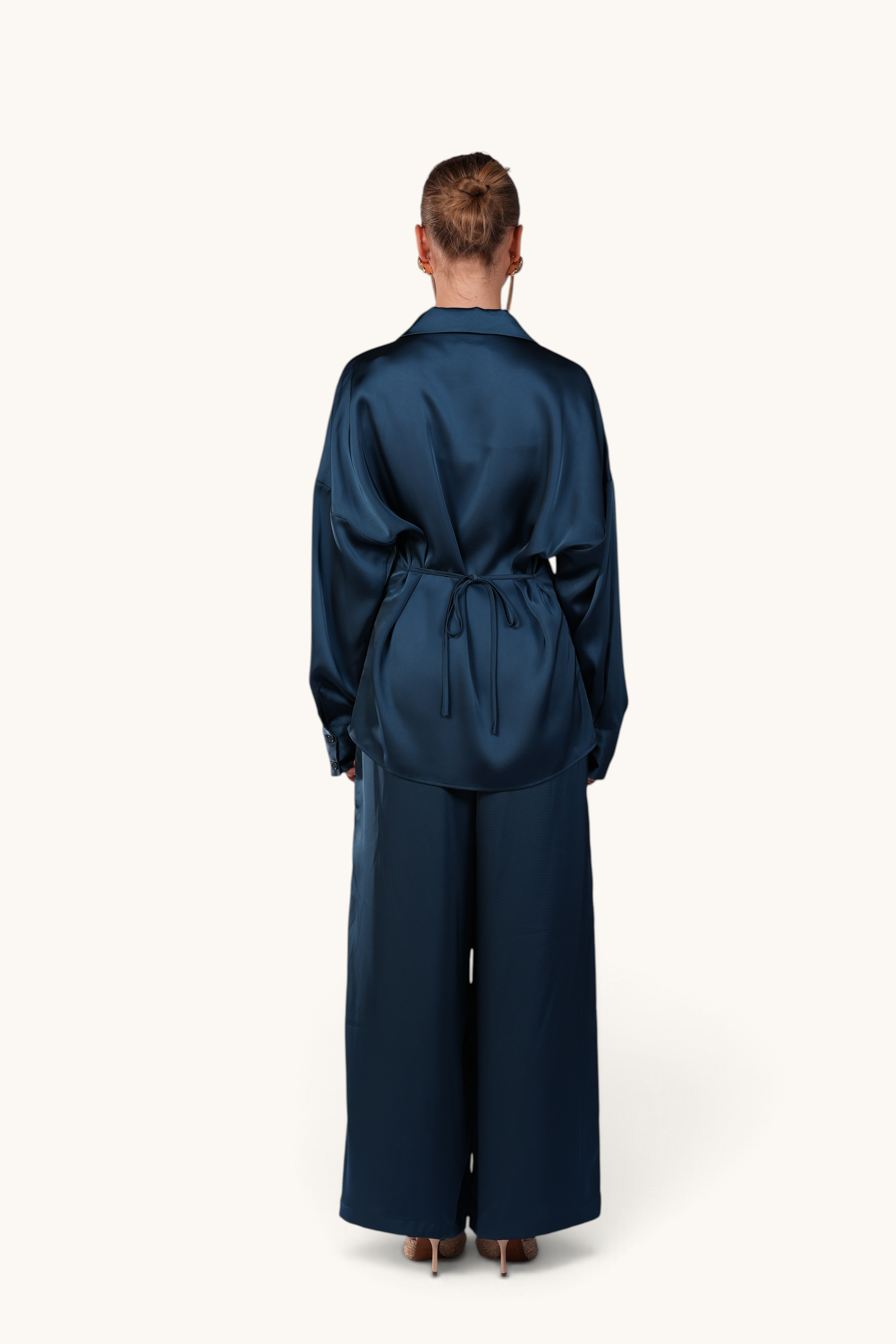LOSYANA La Laguna teal satin two-piece set featuring a flowing blouse with back tie detail and wide-leg trousers