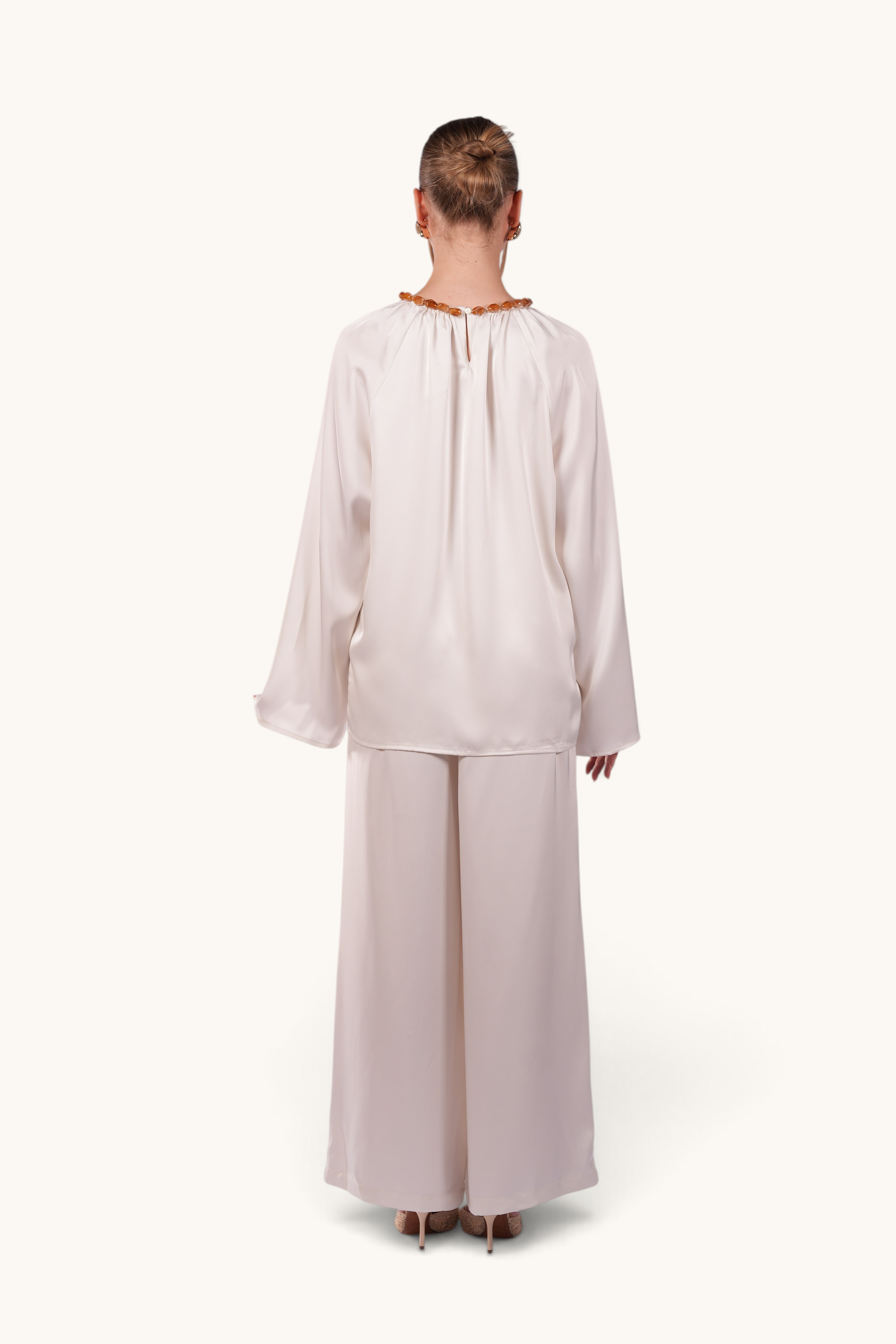 LOSYANA La Marina pearl white satin two-piece set with long sleeves and acrylic stone collar, back view