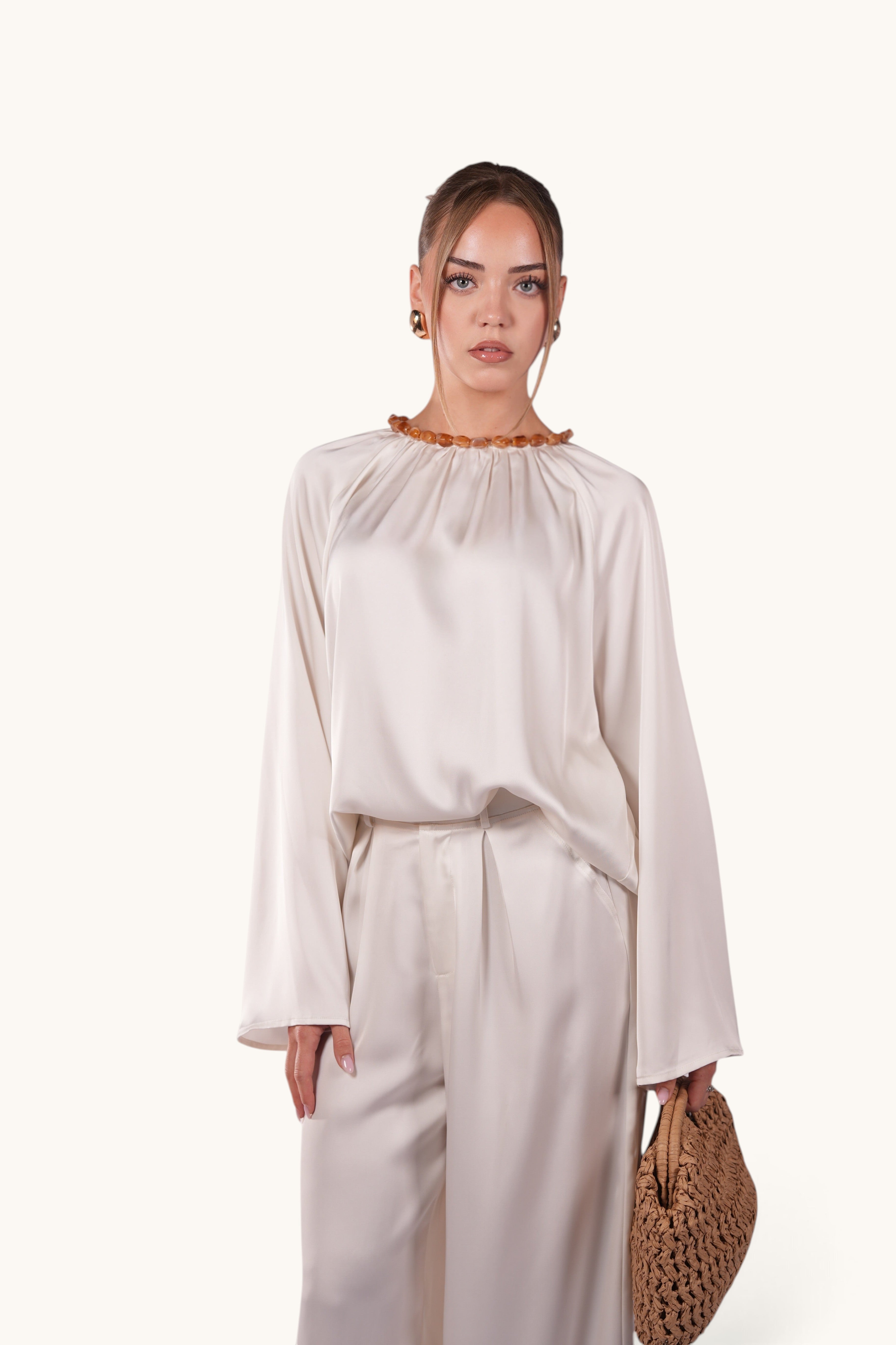 LOSYANA La Marina pearl white satin two-piece set with flowing top, wide-leg trousers, and decorative acrylic collar.