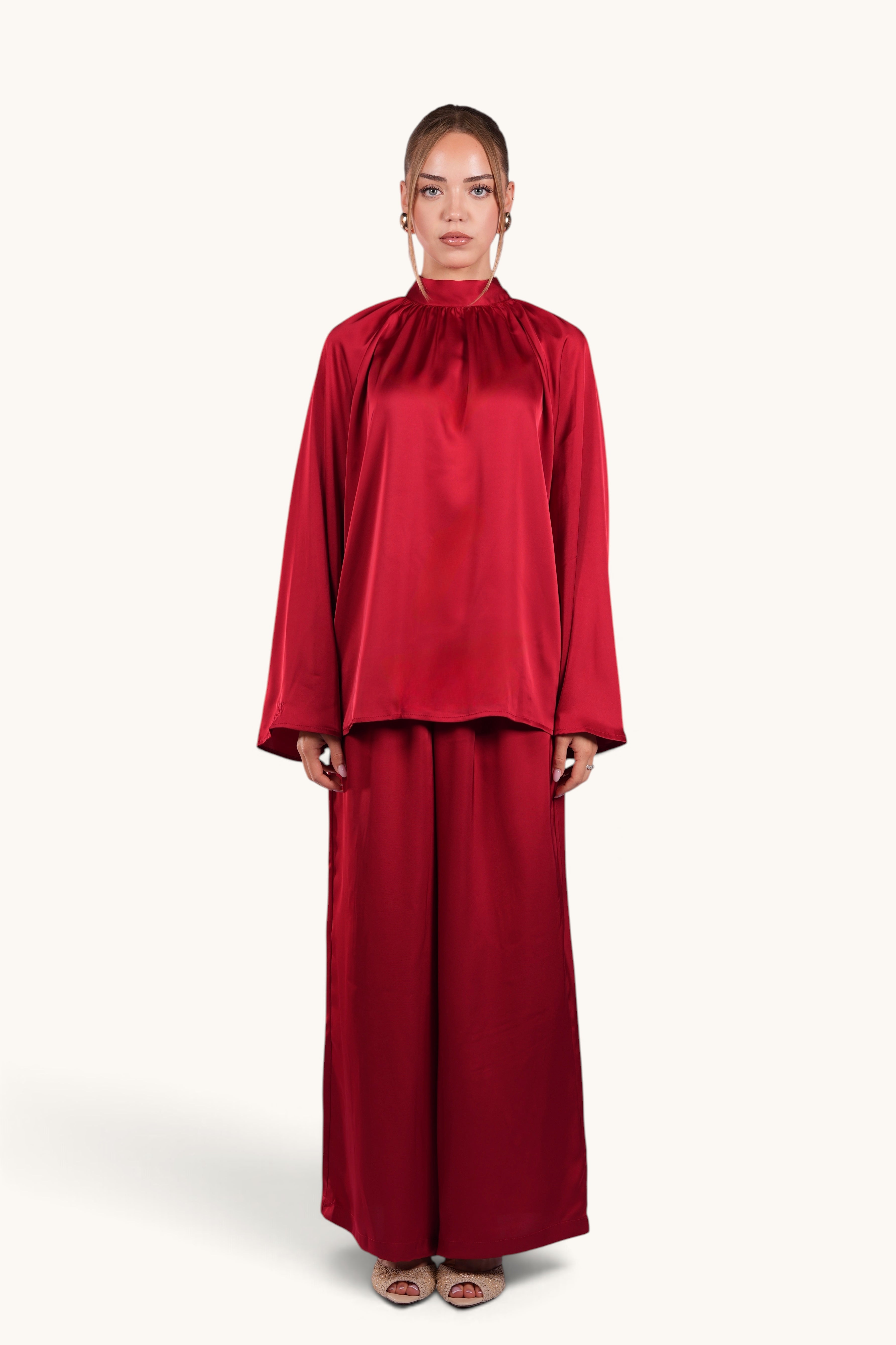 LOSYANA La Palma red satin two-piece set with high collar top and wide-leg trousers on a model