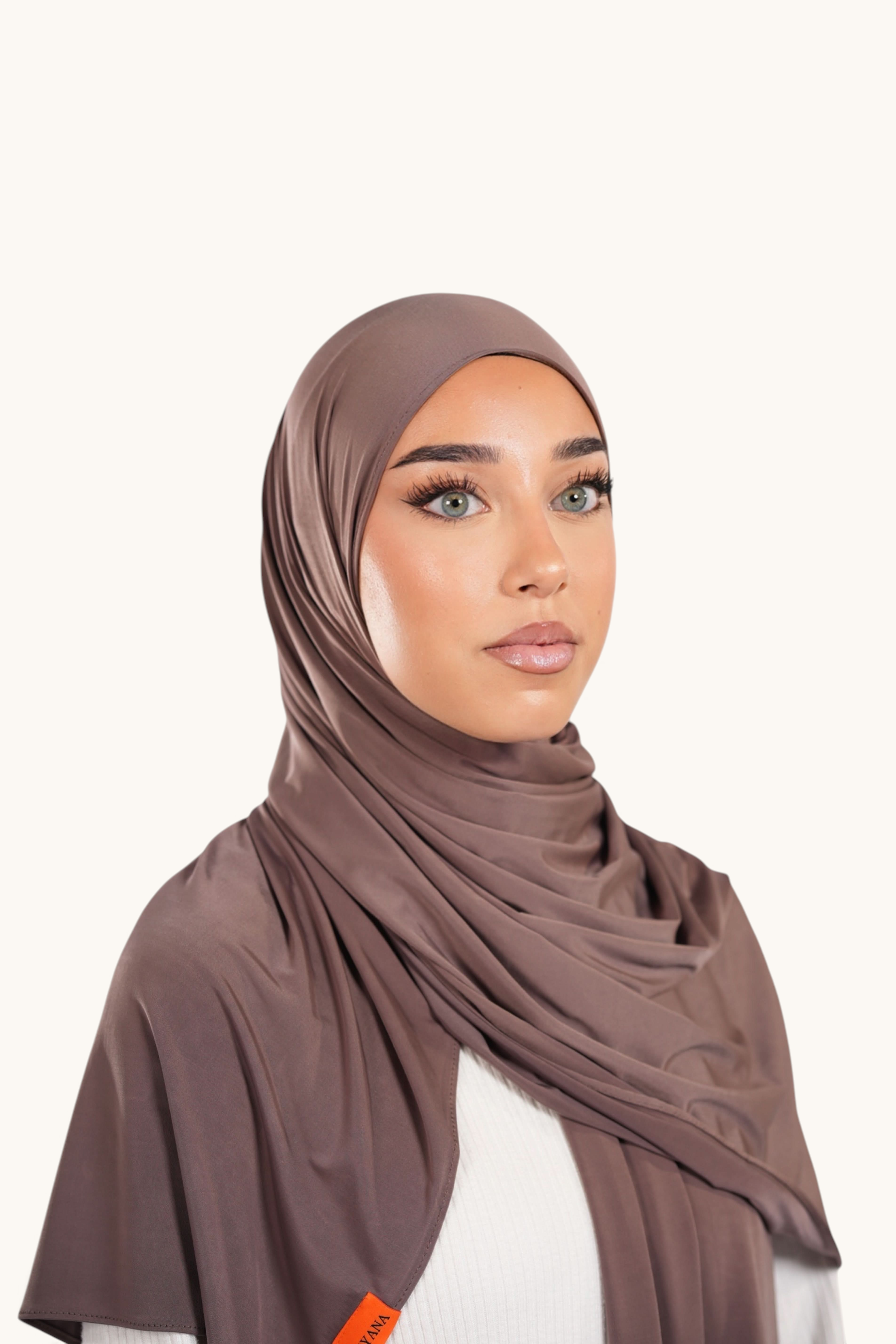 LOSYANA Liquid Jersey hijab in coffee brown with a lightweight, soft sheen finish worn by a model.