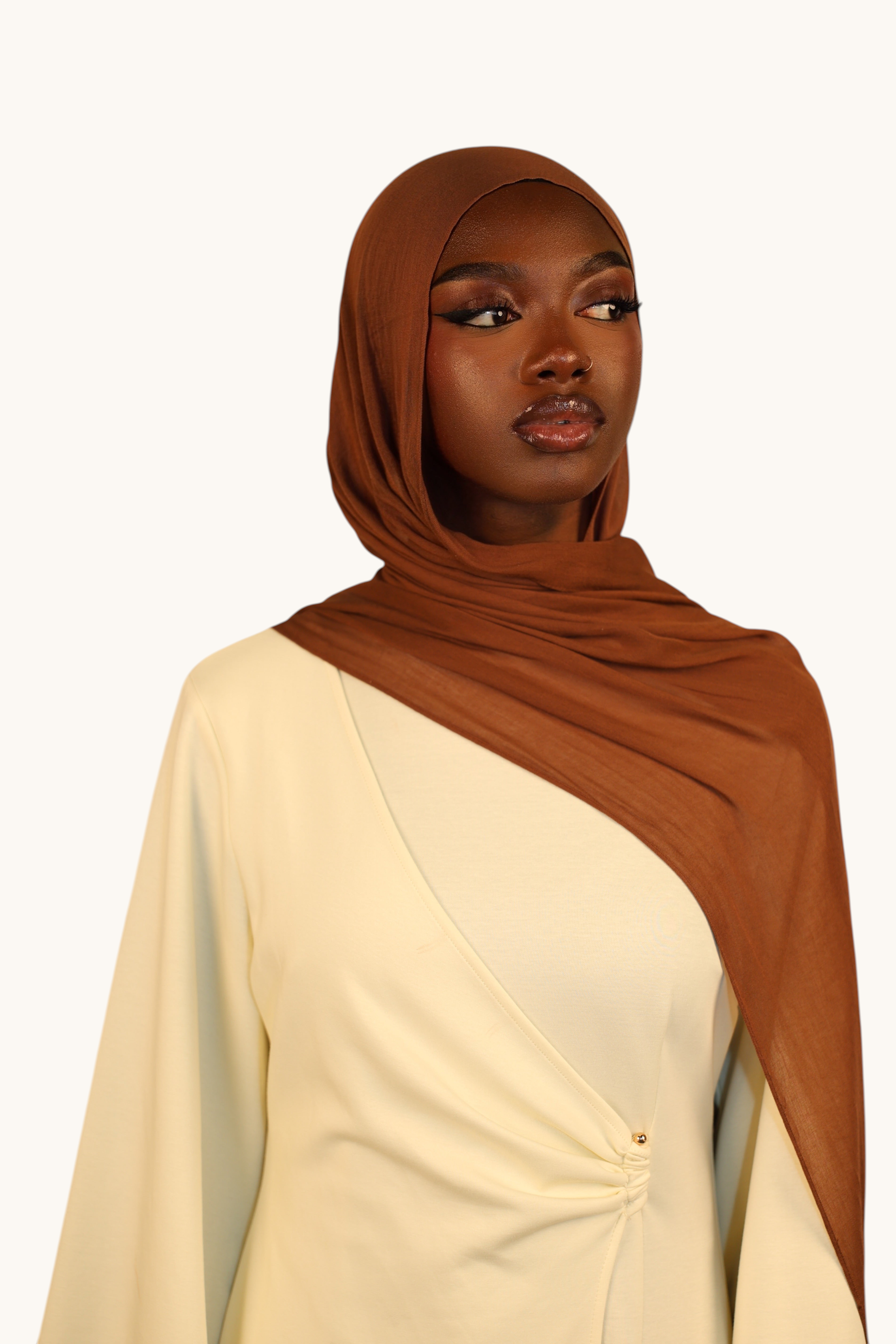 LOSYANA lightweight maroon modal hijab worn by a model in a flowing, elegant style for a breathable summer look.